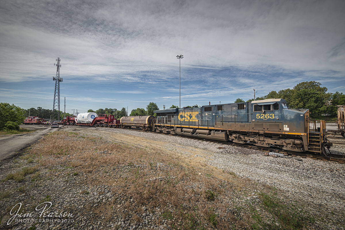 June 3, 2020 - Kasgro (KRL) Caboose 073 brings up the rear of CSX W993-31, with CSXT 5263 leading, as it backs onto the MH&E branch at Atkinson Yard in Madisonville, Kentucky on the Henderson Subdivision. They parked it there for a short while as it waited for a fresh crew to take over the train and continue on it's northbound move. 

The train was running with an oversized load General Electric load on a Kasgro 20 Axel Depressed Deck Car KRL 204040 that has a load limit of 943,900lbs.

Kasgro Rail Corporation builds, maintains, and manages a fleet of nearly 500 specialty railcars which are used for transporting oversized and heavy "dimensional" loads anywhere in the United States Railroad system.

Tech Info: Full Frame Nikon D800, RAW, Irex 11mm, f/11, 1/800 sec, ISO 280.