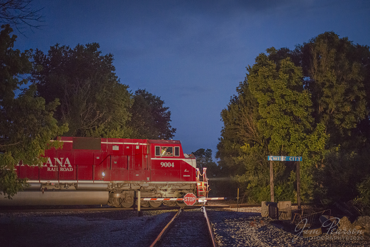 June 18, 2020 - Indiana Railroad (INRD) 9004 leads SAHW-18 (Switz City, IN - Hiawatha, IN), as engineer Travis Collins keeps a watchful eye as he passes through the diamond over the Indiana Southern Railroad at Switz City, Indiana, as he heads north on the INRD Indianapolis Subdivision, as the last light of the day fades from the sky.

Tech Info: Nikon D800, RAW, Nikon 50mm @ 1.4, 1/125, ISO 6,400, Car head lights for lighting.
