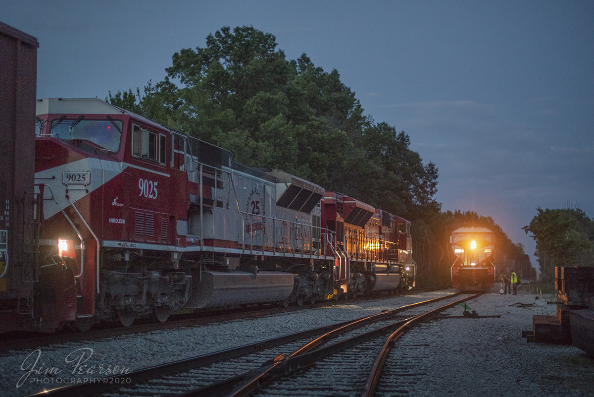 June 18, 2020 - After a 3 hour wait for maintenance-of-way to clear up, the crew of a southbound Indiana Railroad train from Indianapolis (INRD) with engine 9005 leading, meets and does their job briefing with northbound INRD 9004 and INRD's 25th Anniversary engine 9025 trailing, at the north end of BLS Siding at Switz City, Indiana, to trade off trains at dusk.

Tech Info: Nikon D800, RAW, Nikon 50mm @ 1.4, 1/320, ISO 2,500,
