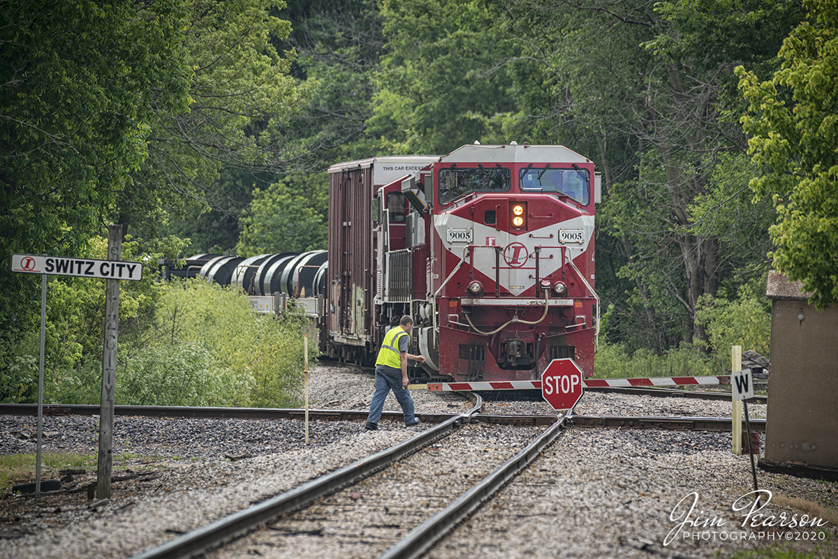 June 18, 2020 - Indiana Railroad (INRD) engineer, Travis Collis, swings the stop sign to the Indiana Southern Railroad track at the diamond in Switz City, Indiana, as he makes his way north with his train, INRD HWSA-18, to the north end of the BLS Siding at Switz City, to meet it's counterpart SAHW-18 coming from Indianapolis.

This is the point where the crew from each train will swap out and the Indy train will return there, whereas Collins train will make a run to Palestine, Illinois before returning to the Hiawatha Yard in Jasonville, Indiana on the Indianapolis Subdivision.

Tech Info: Nikon D800, RAW, Sigma 150-600 @ 360mm, f/6.3, 1/1250, ISO 140.