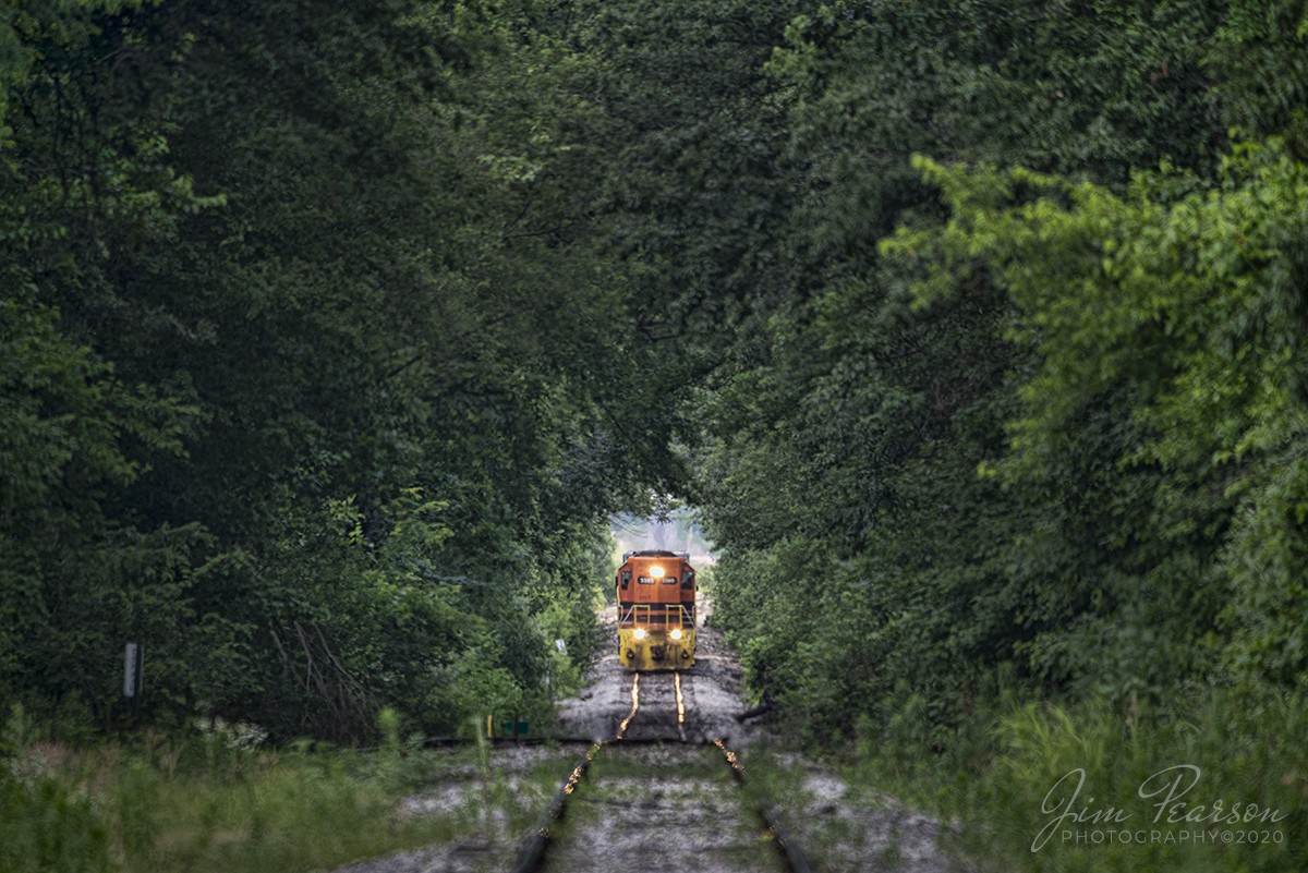 June 18, 2020 - Indiana Southern Railway 3385 heads through a cut of trees with the daily local as it heads into Switz City, Indiana where it will interchange with the Indiana Railroad. (Note: Train was over a mile away, running at 10mph and I was at a crossing when image was shot.)

Tech Info: Nikon D800, RAW, Sigma 150-600 @ 600mm, f/6.3, 1/500, ISO 500.