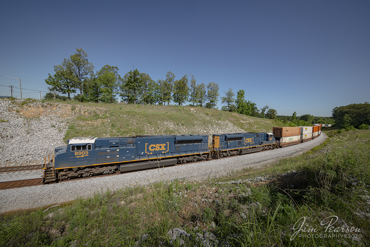 June 14, 2020 - CSXT 8905 & 8900, two SD70ACe-T4 (EMD) locomotives, head up Q025 as it passes through the S curve at Nortonville, Kentucky on track 1, heads south on the Henderson Subdivision with its intermodal loads.

Tech Info: Full Frame Nikon D800, RAW, Irex 11mm, f/8, 1/800, ISO 180.