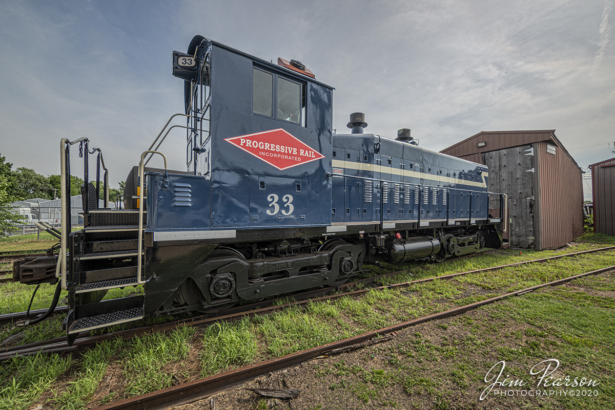 July 15, 2020 - Progressive Rail Inc. 33 sits idling outside a engine house as it prepares for a day of work at the Crab Orchard and Egyptian Railway in Mount Vernon, Illinois. 

According to Wikipedia: The Crab Orchard and Egyptian Railway (reporting mark COER) (formerly American Rail Heritage, Ltd. d/b/a Crab Orchard and Egyptian Railroad Company) is a Class III common carrier shortline railroad that operates in the cities of Marion and Herrin in the Southern Illinois region. It is most historically recognized by the FRA for being the last U.S. railroad of any kind to use steam locomotives exclusively in regular revenue freight service up until 1986.

The present-day shortline currently operates a total of 13.5 miles of track across the industrial centers of Williamson County in two separate railroad districts with a fleet of two diesel switcher engines. One line being known as the "Marion District", which is the railroad's main working division with roughly 8.5 miles of track; and the other division being the "Herrin District", which mostly serves the city's manufacturing industries along a 5-mile stretch of track.

It also has three different interchange points with two Class I railroads. Near their main offices in downtown Marion, the railroad has a junction with Union Pacific's Marion Subdivision; another interchange is located in the nearby Marion suburb of Bainbridge with BNSF Railway's Beardstown Subdivision. A second BNSF connection with the same line is also present in the Herrin district. Most of the CO&E Railroad's revenue freight products primarily consist of coal, lumber, petroleum, grain, steel, paper, chemicals, manufactured goods, and railcar repair service.

Tech Info: Full Frame Nikon D800, RAW, Irex 11mm, f/5, 1/640, ISO 100.