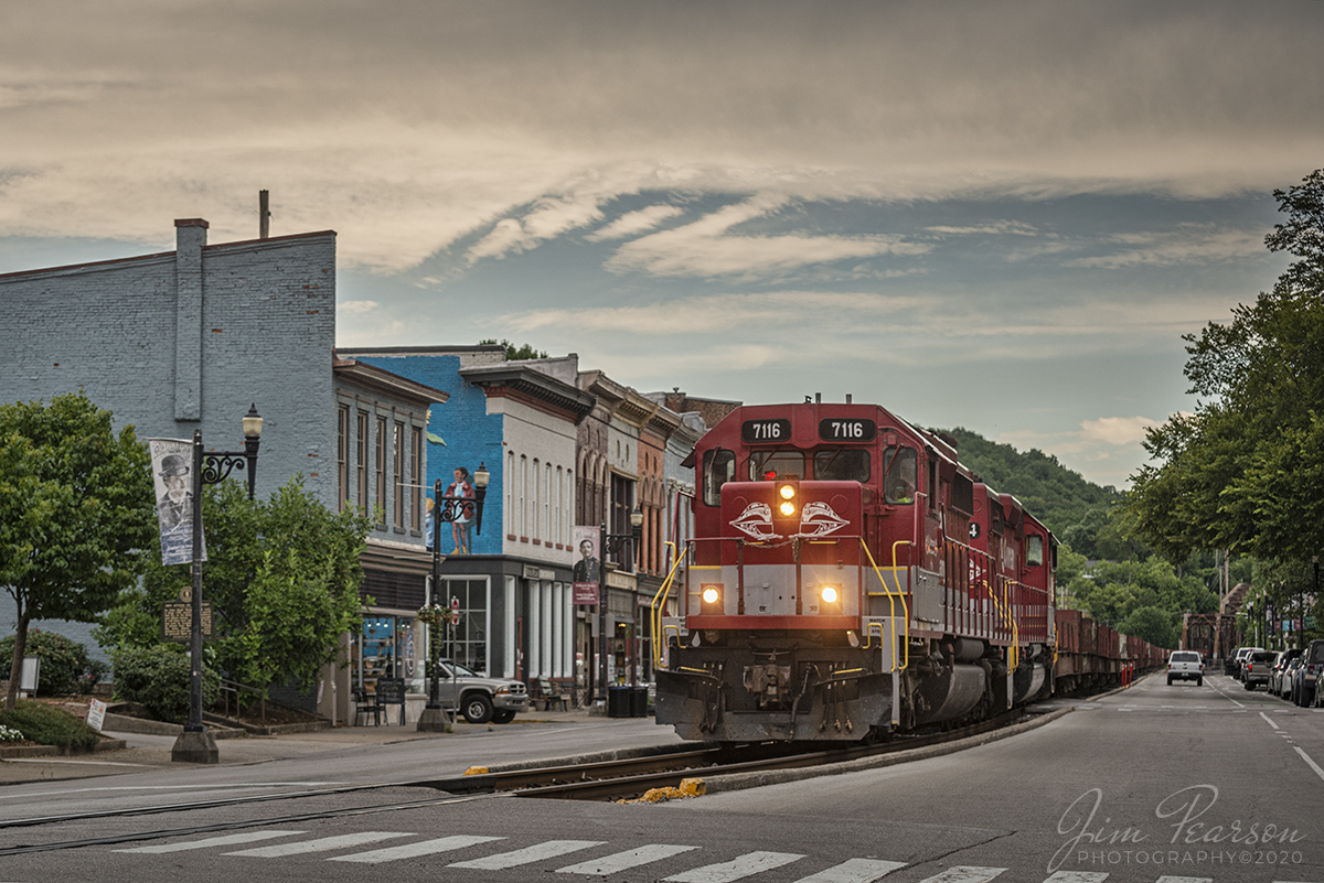 July 17, 2020 - RJ Corman 7116 moves at a snails pace as it  leads the empty ALCAN train southbound through downtown Frankfort, Kentucky on its way to Logan Aluminum in Brea, Kentucky to pickup another load of aluminum ingots.

Tech Info: Full Frame Nikon D800, RAW, Nikkor 70-300 @ 75mm, f/5.6, 1/4000, ISO 220.