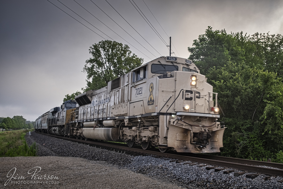 July 21, 2020 - CSX K815-19, with CP 7021, approaches the crossing at Old State Road outside Darmstadt, Indiana as it heads south on the CSX CE&D Subdivision with a loaded phosphate train.

Canadian Pacific unveiled 5 of these specially painted locomotives in November of 2019 on Remembrance Day in Canada and Veterans Day in the U.S. honoring the culture and history of the armed forces. The five Electro-Motive Diesel SD70ACUs will take the message of military pride across the CP system.

CP 7021 wears the sand colour that the Canadian and U.S. armies apply to fighting vehicles and equipment serving in arid climates.

Tech Info: Fuji XT1, RAW, Fuji 18-55mm @ 18mm, f/5.6, 1/250, ISO 200.