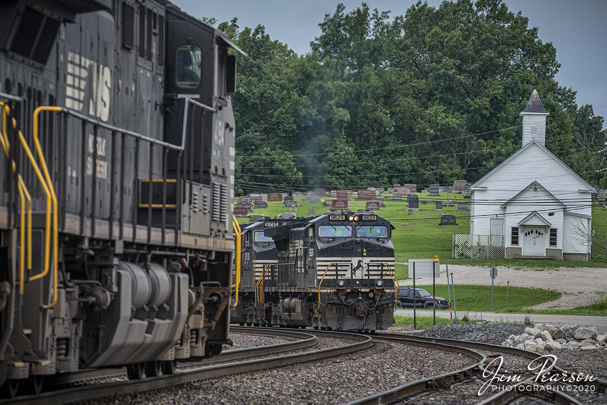 Norfolk Southern 4194 glides downhill as it leads NS 124-31 westbound, with an all Autorack train, as it meets NS 376-01 led by NS 9626, a  eastbound mix freight train, across the street from the Taswell Community Church at Taswell, Indiana on the NS Southern-West District.

Tech Info: Full Frame Nikon D800, RAW, Sigma 150-600 @ 195mm, f/5.6, 1/800, ISO 1400.