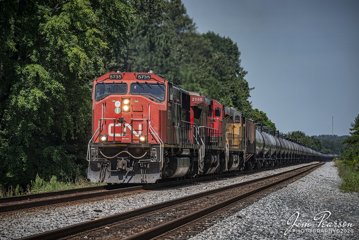 August 17, 2020 - Canadian National 5735, 2138 and Union Pacific 5446 head up CSX K421, a loaded ethanol train, as it makes its way down the main at the south end of the siding at Slaughters, Kentucky as it heads south on the Henderson Subdivision. 

Tech Info: Full Frame Nikon D800, RAW, Sigma 150-600 @ 150mm, f/7.1, 1/640, ISO 100.