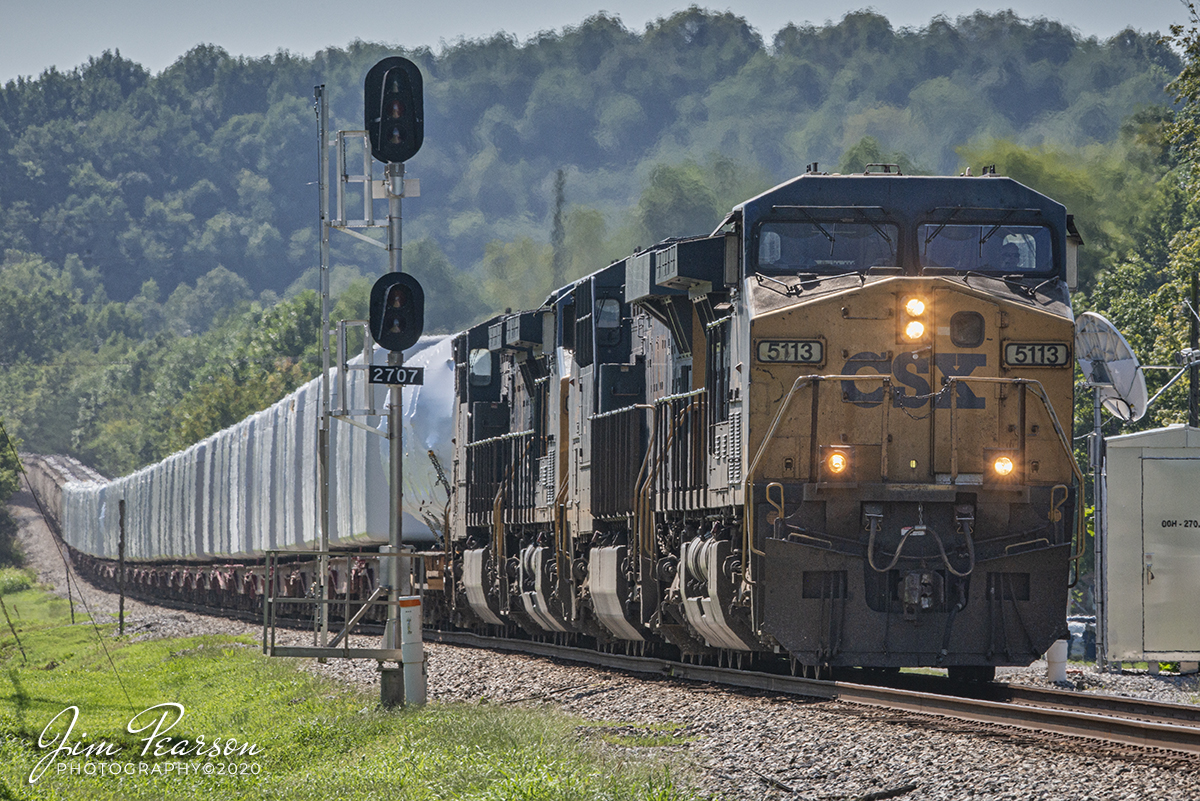 August 17, 2020 - CSXT 5113 leads CSX W992 as it passes the approach lit signals in downtown Earlington, Ky with a load of windmill housings and motors, with a load of grain cars tagged onto the end of its train as it heads north on the Henderson Subdivision.

Tech Info: Full Frame Nikon D800, RAW, Sigma 150-600 @ 340mm, f/22, 1/200, ISO 100.