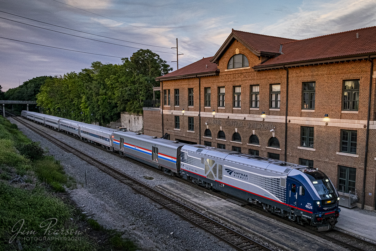 August 29, 2020 - Amtrak 393 (The Illini) pulls into the old Illinois Central (IC) Depot in downtown Mattoon, Illinois with 4624 leading the Sunday evening southbound train from Chicago to Carbondale, Illinois as the last bit of sunlight lights up the scene. According to the Amtrak App the train was running out of Chicago at 44% capacity during this COVID-19 days.

According to Wikipedia, The Mattoon station is housed in the former Illinois Central Railroad Depot. The depot was completed in 1918 and placed on the National Register of Historic Places in 2001. At its height, the building housed a power plant, mail room, luggage room, and restaurant, in addition to the main hall where passengers waited to board trains. As many as ten trains a day departed the depot in the 1950s.

During 2010, a $3 million restoration project, paid for from a mix of private, state, and federal funding, was undertaken, replacing paint, flooring, and other interior fixtures. 

The station currently serves as a stop for the Illini, Saluki, and City of New Orleans passenger trains. The tracks themselves, formerly part of the Illinois Central Railroad, are now owned by the Canadian National Railway (CN). Freight trains run by CN pass through frequently as this is on the CN Champaign Subdivision.

Tech Info: Fuji XT-1, RAW, Fuji 18-55mm @ 18mm, f/8, 1/180, ISO 800.