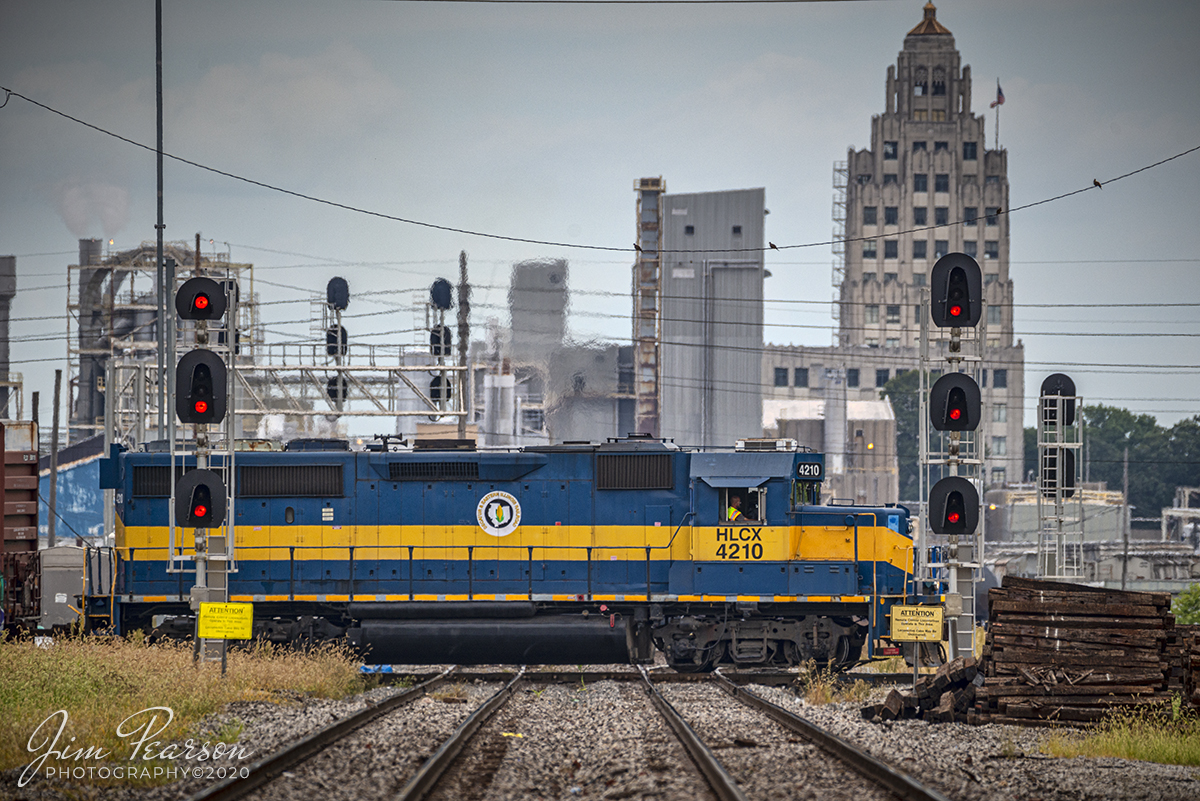August 29, 2020 - In this long lens shot from a public crossing we see Decatur & Eastern Illinois Railroad (DERI) HLCX 4210 as it crosses over the Wabash & Illinois Central (WALBIC) diamond at Decatur, Illinois as it heads back to its yard after working various industries around the city.

According to Wikipedia: The Decatur & Eastern Illinois Railroad (reporting mark DREI) is an American regional railroad that is a subsidiary of Watco Companies operating in eastern Illinois and western Indiana.

In January 2018, CSX Transportation announced that it was seeking offers to buy the Decatur Subdivision and the Danville Secondary Subdivision as part of a system-wide sale of low-traffic routes, and in July, Watco, via the DREI, was identified as the winning bidder. Following regulatory approval from the Surface Transportation Board, The DREI began operations on September 9, 2018.

The DREI operates two intersecting routes totaling 126.7 miles (203.9 km)the former Decatur Subdivision between Montezuma, Indiana and Decatur, Illinois, and the former Danville Subdivision between Terre Haute, Indiana and Olivet, Illinois. It interchanges traffic with CSX, the Eastern Illinois Railroad, the Norfolk Southern Railway, the Canadian National Railway, and the Union Pacific Railroad. The railroad is headquartered in Decatur, Illinois.

Tech Info: Full Frame Nikon D800, RAW, Sigma 150-600 @ 460mm, f/6, 1/1000, ISO 220.