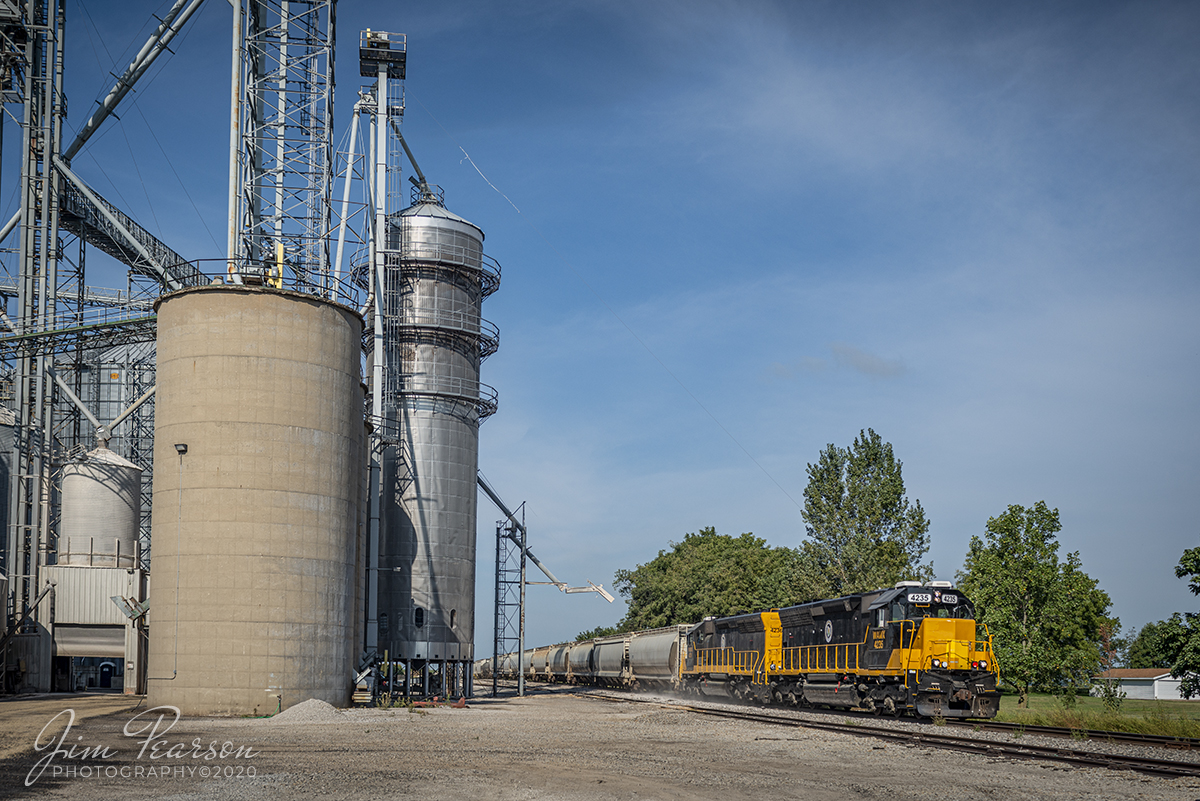 August 29, 2020 - Decatur & Eastern Illinois Railroad (DERI) 101 with 4235 & 4236 leading the way, passes the Top Flight Grain elevators at Pierson Station, Illinois as it heads east to Terre Haute, Indiana (where they interchange with CSX) on the former CSX Danville Subdivision (now the DERI).

According to Wikipedia: The Decatur & Eastern Illinois Railroad (reporting mark DREI) is an American regional railroad that is a subsidiary of Watco Companies operating in eastern Illinois and western Indiana.

In January 2018, CSX Transportation announced that it was seeking offers to buy the Decatur Subdivision and the Danville Secondary Subdivision as part of a system-wide sale of low-traffic routes, and in July, Watco, via the DREI, was identified as the winning bidder. Following regulatory approval from the Surface Transportation Board, The DREI began operations on September 9, 2018.

The DREI operates two intersecting routes totaling 126.7 miles (203.9 km)the former Decatur Subdivision between Montezuma, Indiana and Decatur, Illinois, and the former Danville Subdivision between Terre Haute, Indiana and Olivet, Illinois. It interchanges traffic with CSX, the Eastern Illinois Railroad, the Norfolk Southern Railway, the Canadian National Railway, and the Union Pacific Railroad. The railroad is headquartered in Decatur, Illinois.

Tech Info: Full Frame Nikon D800, RAW, Sigma 24-70 @ 31mm, f/5, 1/1000, ISO 100.