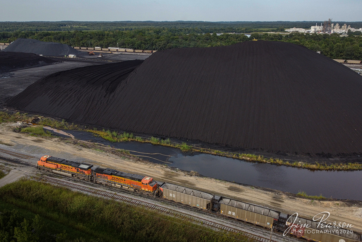 September 14, 2020 - BNSF 5794 and 6299 lead a loaded coal train through the loop at the Calvert City Terminal in Calvert City, Kentucky as it is halfway through unloading its train.

Tech Info: DJI Mavic Mini Drone, JPG, 4.5mm (24mm equivalent lens) f/2.8, 1/500, ISO 100.