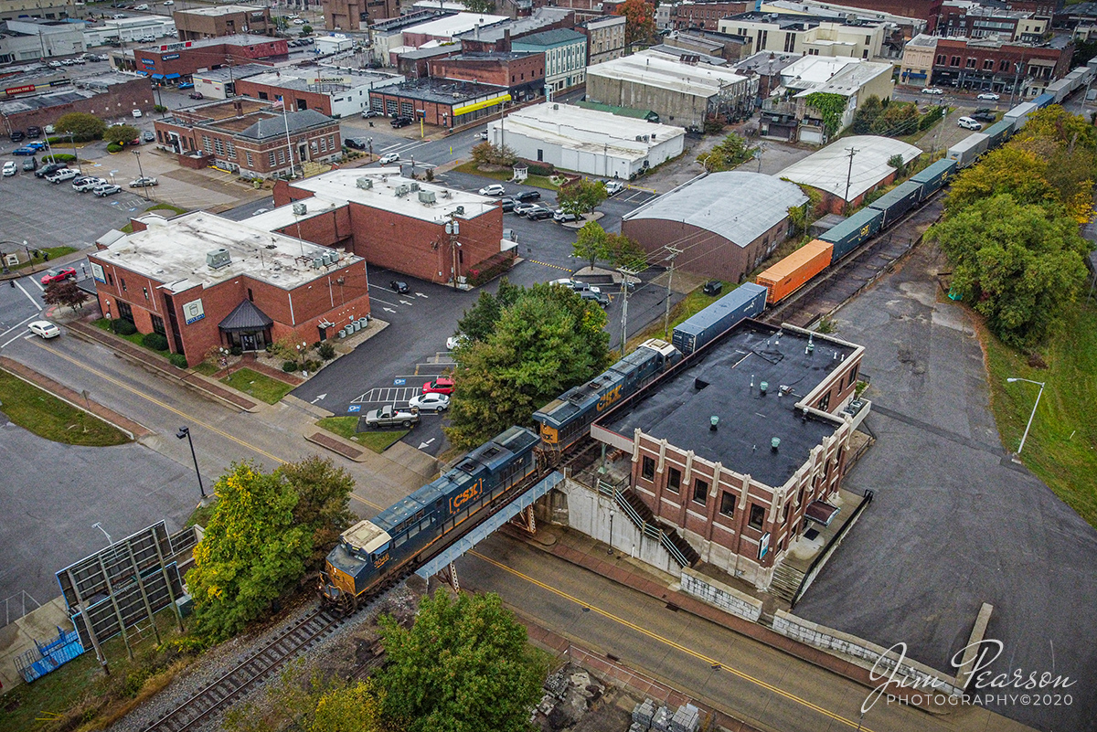 Northbound!

CSX hot intermodal Q026-11 (Jacksonville, FL to Chicago, IL) passes the old Louisville & Nashville Railway Depot, as it rolls through downtown Madisonville, Kentucky on its way north on the Henderson Subdivision on October 12, 2020.

Madisonvilles remodeled train station (opened in September 1929) at 38 West Arch Street station is currently being used as a Kentucky Innovation Station, which is a co-working and business-incubation space.

Small-business owner-operators, traveling professionals and students can work independently of one another, but in a modernized shared office space, which also houses the offices of Madisonville-Hopkins County Economic Development Corporation. 

Tech Info: Full Frame Nikon D800, Sigma 150-600 @ 210mm, f/6.3, 1/500, ISO 200.