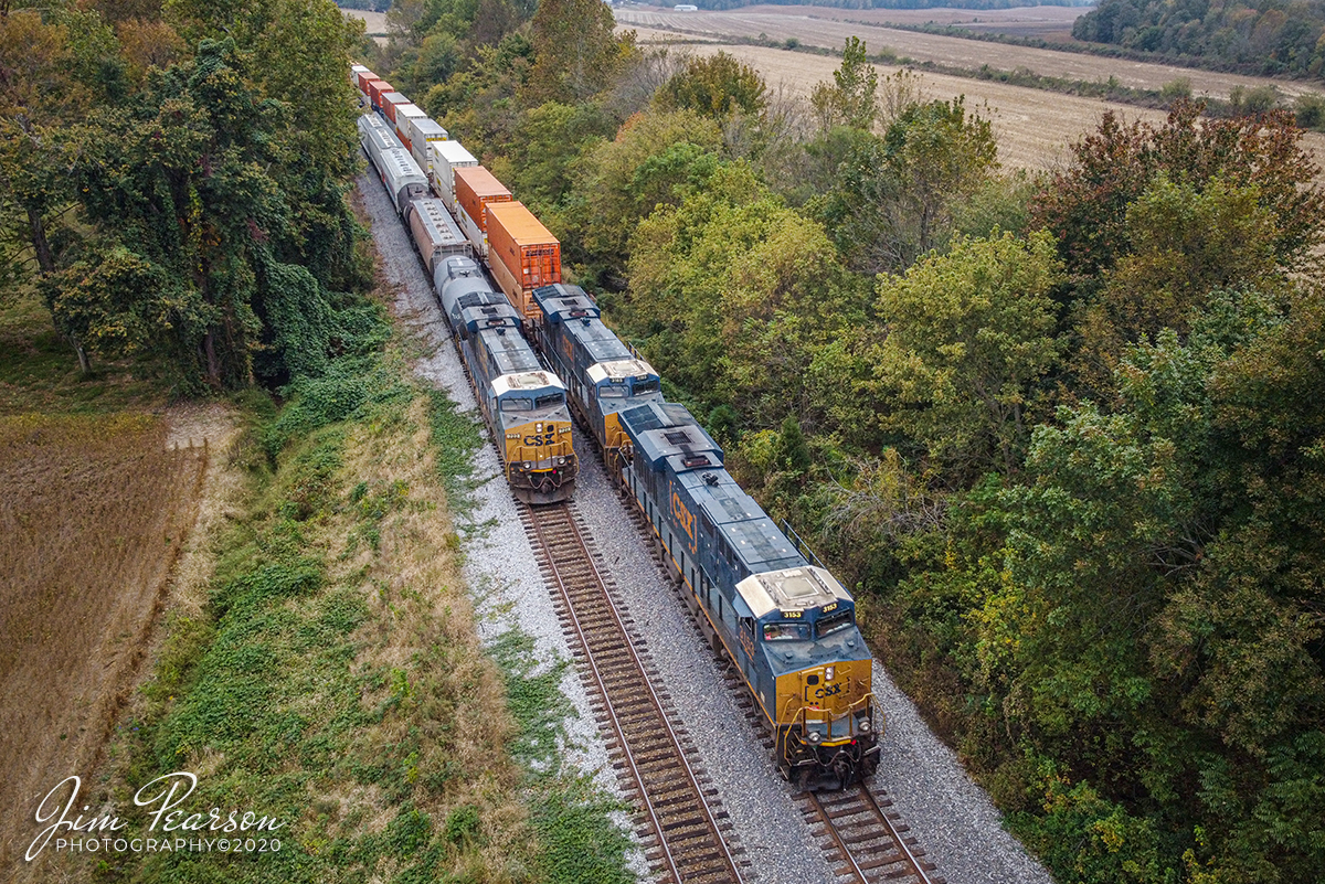 CSX meet at Slaughters, Ky

With shades of color beginning to show in the surrounding trees, a northbound CSX 028, with CSXT 3153 and 3165 leading, passes the DPU end (CSXT 722) of a southbound CSX Q503 in the siding at Slaughters, Kentucky on the Henderson, kentucky on October 12, 2020.

#trainphotography #railroadphotography #trains #railways #dronephotography

Tech Info: DJI Mavic Mini Drone, JPG, 4.5mm (24mm equivalent lens) f/2.8, 1/200, ISO 200.
