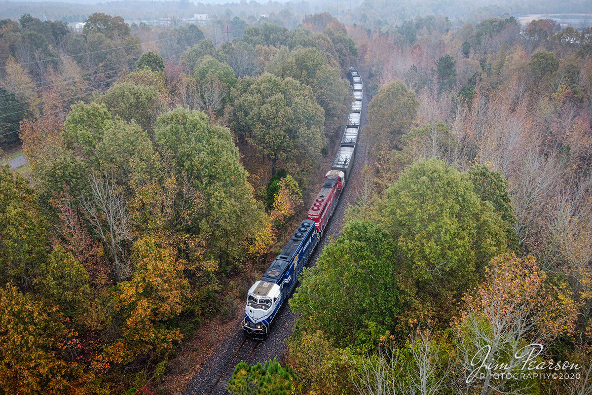 PAL UK and U of L leading empty coal

A Paducah and Louisville Railway empty coal train travels along the Warrior Coal Mine Lead, with University of Kentucky (2012) and University of Louisville (2013) leading the way, as it approaches AC Slaton road as it makes its way to Warrior Coal mine to pick up another load of coal for the Calvert City Terminal on October 27, 2020 in a light foggy mist.

Tech Info: DJI Mavic Mini Drone, JPG, 4.5mm (24mm equivalent lens) f/2.8, 1/200, ISO 100.