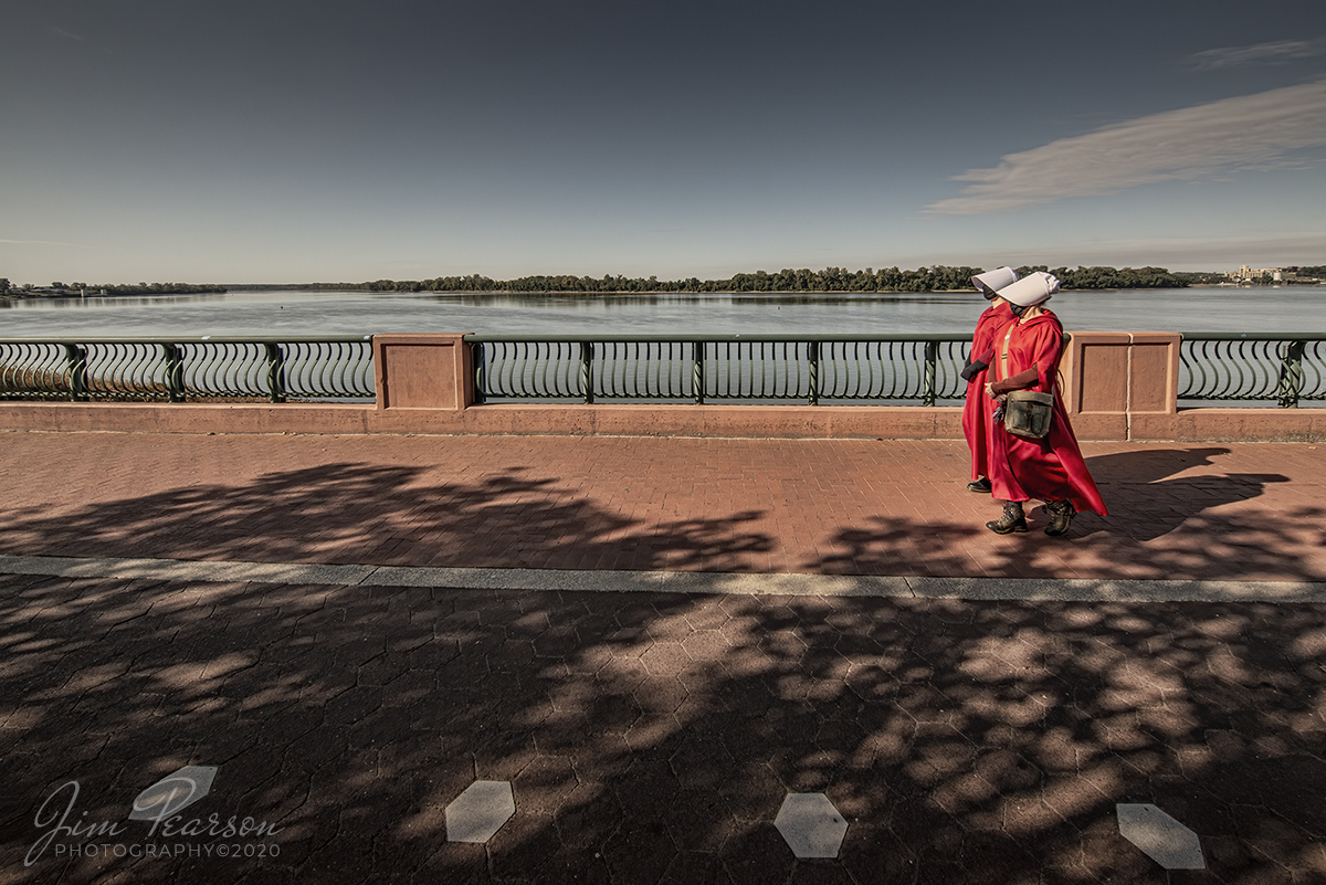 October 3, 2020 - While I spent most of today railfanning, I did take some time to participate in Scott Kelby's Worldwide Photowalk. This shot is my entry into the contest and it is of two ladies that were walking along the riverwalk dressed in "Handmaid's" robes at Evansville, Indiana, USA.

Tech Info: Full Frame Nikon D800, RAW, Irex 11mm, f/9, 1/1000, ISO 800.