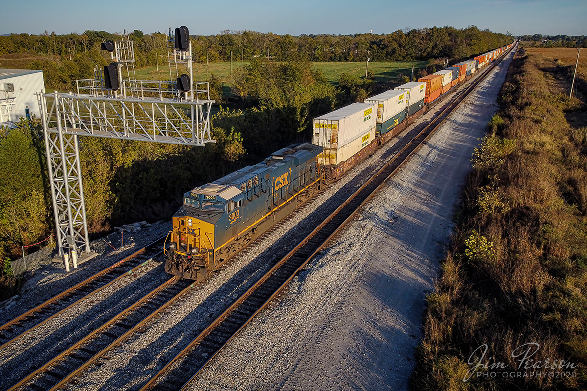 Jacksonville, FL - Bedford Park, IL Daily

CSXT 3003 leads intermodal Q026-15 north on the Henderson Subdivision as it passes under the signals at the south end of Casky Yard on October 16, 2020 at Hopkinsville, Kentucky. It is one of four hot intermodals that run up and down the Henderson Sub and they are Q025 & Q029 SB along  with their counterparts Q028 & Q026.

Tech Info: DJI Mavic Mini Drone, JPG, 4.5mm (24mm equivalent lens) f/2.8, 1/640, ISO 100.