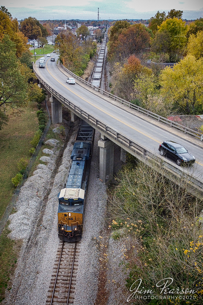 E303 - Stilesboro, GA - Evansville, IN (EVWR) 

CSXT 3062 passes under the North Main Street overpass on November 5th, 2020, with empty coal train E303, as it heads north on the Henderson Subdivision at Madisonville, Ky as it heads to Evansville, Indiana. There the Evansville Western Railway will pick-up the empty train and load it at Sugar Camp Mine (Akin, IL).

Tech Info: DJI Mavic Mini Drone, JPG, 4.5mm (24mm equivalent lens) f/2.8, 1/320, ISO 100.