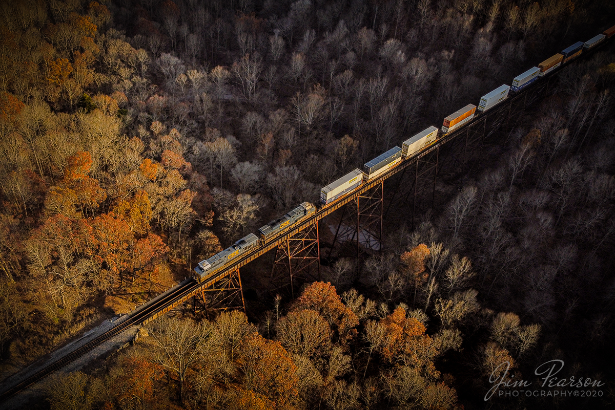 CSX Q028-10 Atlanta, GA - Chicago, IL 

CSXT 5412 leads hot intermodal north Q028-10 across the Gum Lick Trestle between Kelly and Crofton, Kentucky as the last rays of the fall sunset rakes through the valley on the Henderson Subdivision.

Tech Info: DJI Mavic Mini Drone, JPG, 4.5mm (24mm equivalent lens) f/2.8, 1/400, ISO 100.