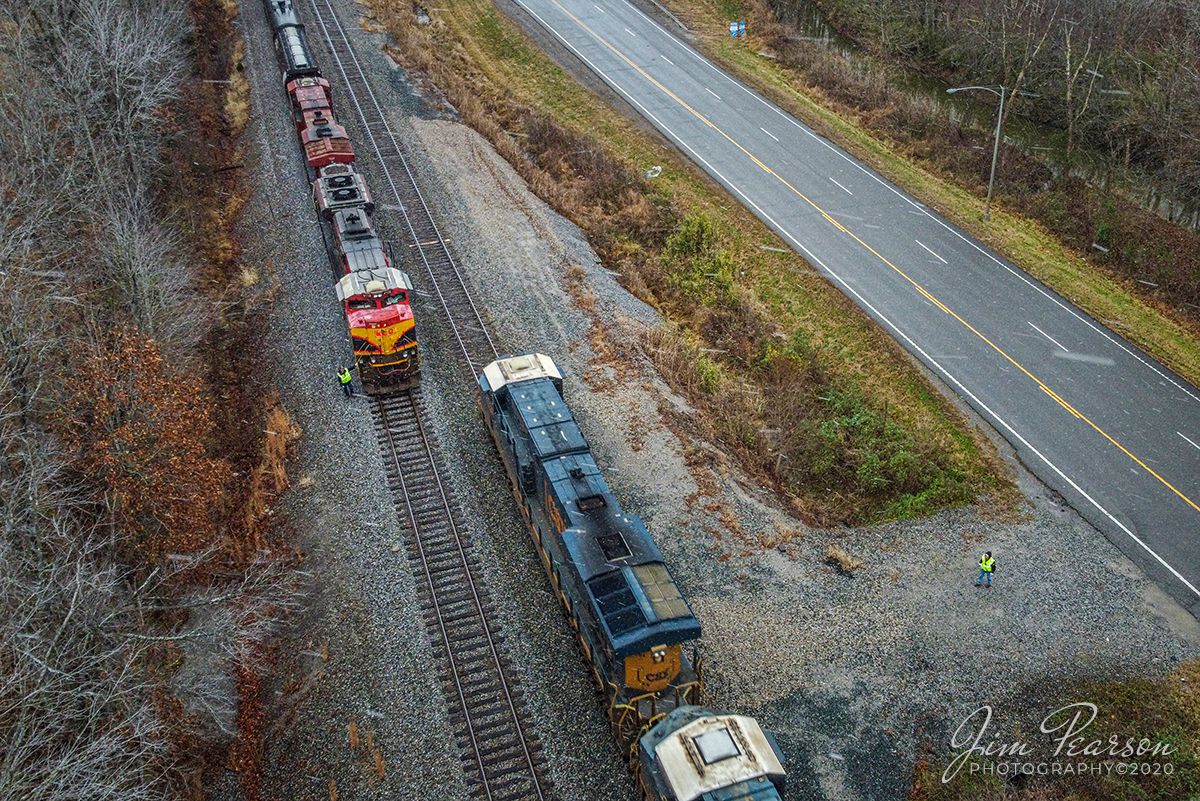 CSX K413-29 and Q026 meet at Nortonville, Ky

As the first light snow of winter 2020 steaks trough the sky the Engineer and Conductor of loaded ethanol train CSX K413-29 (Kansas City Southern 4107 & Canadian Pacific 8849) do a roll-by inspection at Romney of CSX Q026-29 on November 30th, 2020 as it makes its way north on the Henderson Subdivision.

Tech Info: DJI Mavic Mini Drone, JPG, 4.5mm (24mm equivalent lens) f/2.8, 1/100, ISO 200.