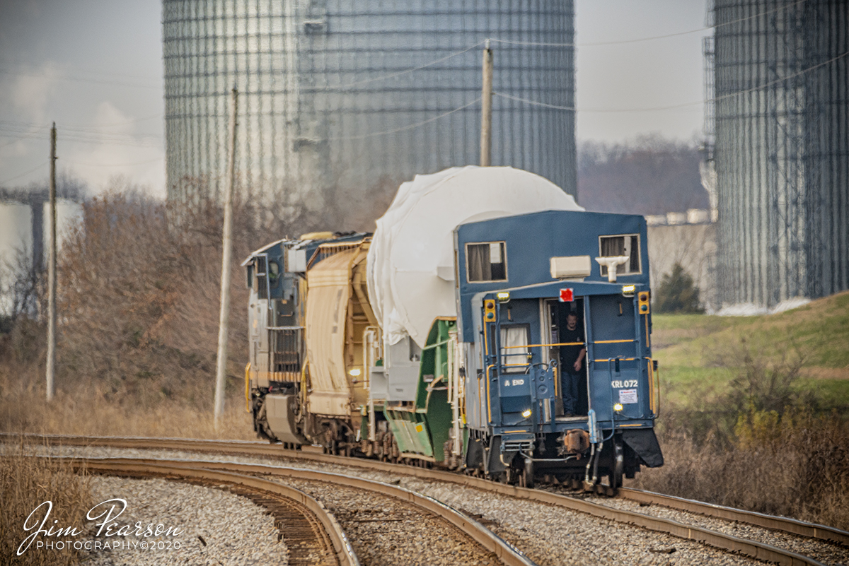 KRL Caboose 072 bringing up the rear of CSX W991 at Hopkinsville, KY

A GE employee looks out the door of Kasgro Rail Corporation (KRL) caboose 072 as CSX W991-29 heads north on the Henderson Subdivision at Casky Yard in Hopkinsville, Kentucky with a high and wide load for GE, on December 5th, 2020.

Tech Info: Nikon D800, RAW, Sigma 150-600 @ 600mm, f/6.3, 1/1000, ISO 450.