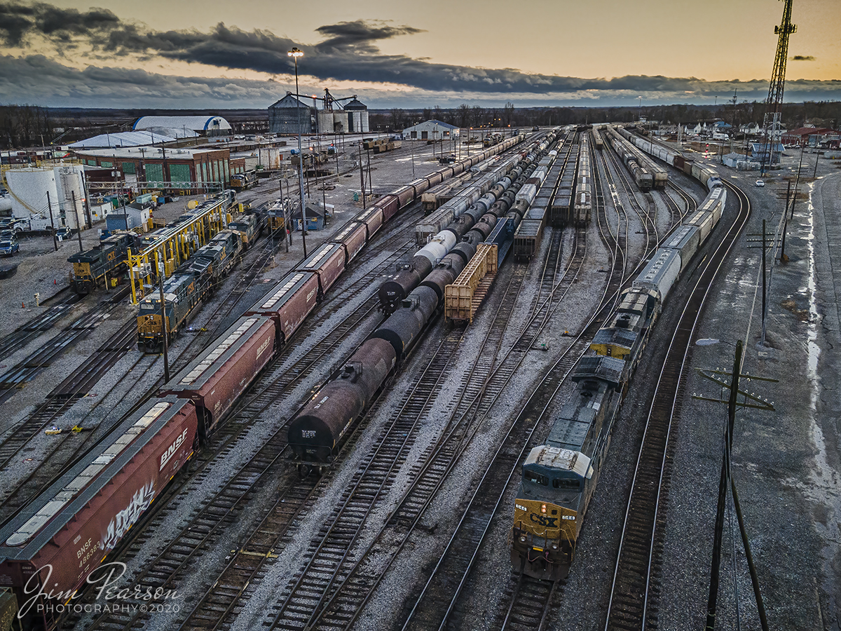 Sunset arrival of Northbound CSX Q512-01 at Howell Yard, Evansville, IN

They say what you do on the first day of the New Year you'll continue to do till the next New Year and so of course I spent the day chasing trains around the Evansville, Indiana area.

Here we find the crew on CSX Q512 as they pull to a stop at the north end of CSX Howell Yard in Evansville as they prepare to conduct a crew change before heading on north, as dusk falls over the yard on New Years day, January 1st, 2021.

Tech Info: DJI Mavic Air 2 Drone, JPG, 4.5mm (24mm equivalent lens) f/2.8, 1/120, ISO 400.