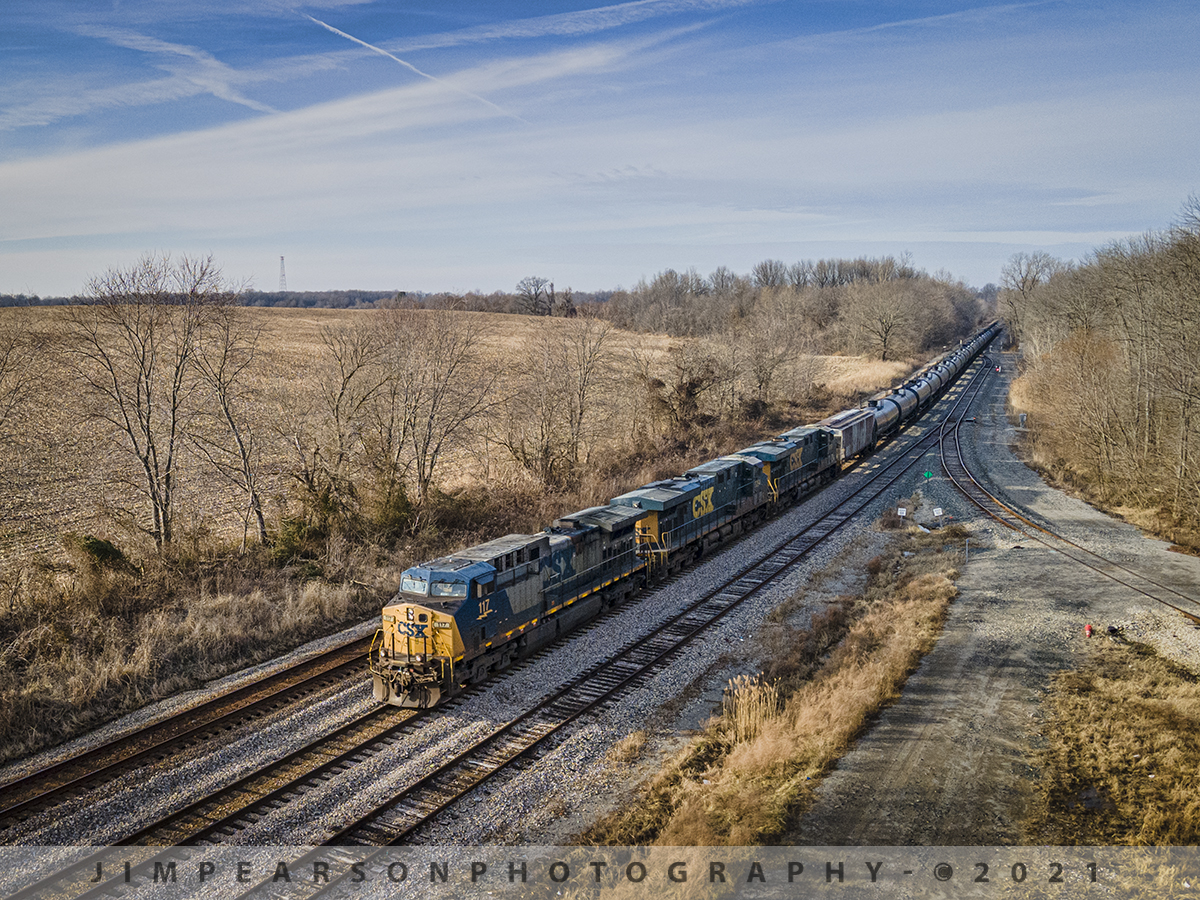 CSXT 117 in YN2 Paint leads K423-05 South on the Henderson Subdivision

CSX loaded tank train K423-05 leads it's snake like train as it makes it's way through Anaconda between Robards and Sebree, Kentucky on January 6th, 2021 as it heads south on the Henderson Subdivision.

Tech Info: DJI Mavic Air 2 Drone, RAW, 4.5mm (24mm equivalent lens) f/2.8, 1/640, ISO 100.