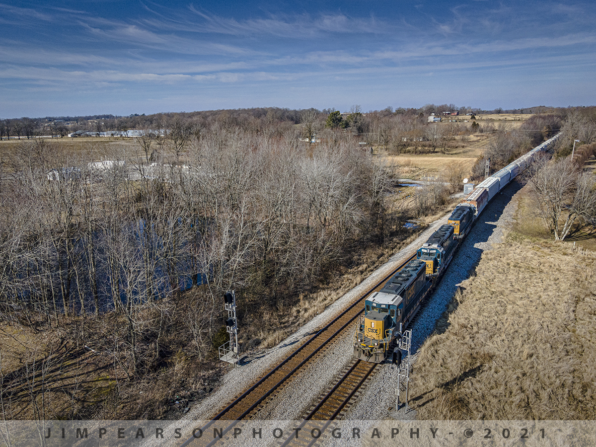 Taking the siding at Crofton, Ky

The southbound daily local from Casky yard in Hopkinsville, KY, CSX J732-13, slides into the siding at the north end of Crofton, KY to meet northbound Q512 on January 13th, 2021 after completing it's work at Atkinson Yard in Madisonville, KY on the Henderson Subdivision with three SD40's leading the way.

Tech Info: DJI Mavic Air 2 Drone, RAW, 4.5mm (24mm equivalent lens) f/2.8, 1/800, ISO 100.