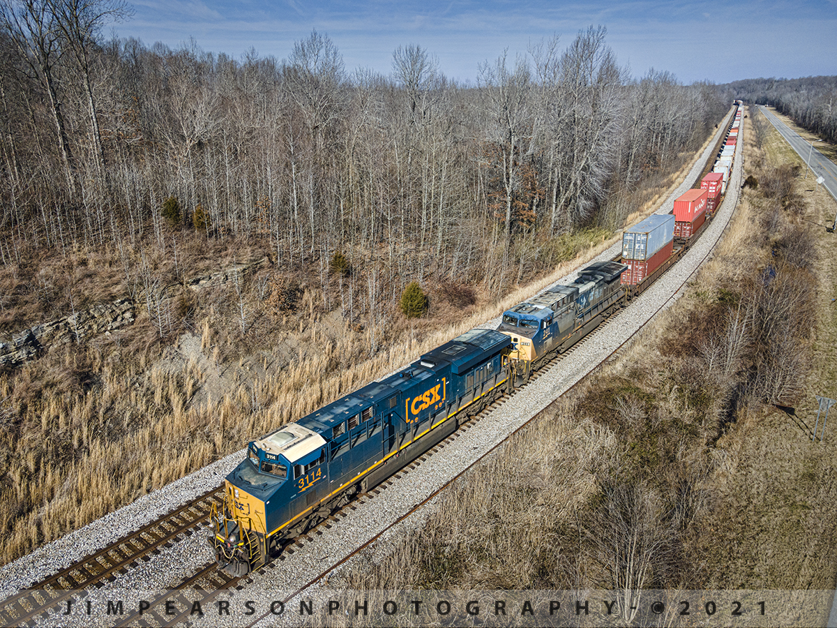 CSXT 3114 and 241 lead Q025 South at Nortonville, Ky

CSX hot intermodal Q025-13 (Bedford Park, IL - Jacksonville, FL Daily) rounds the curve coming into Romney at Nortonville, Kentucky as CSXT 3114 leads the train south on the Henderson Subdivision on a beautiful winter's morning on track 1. 

Tech Info: DJI Mavic Air 2 Drone, RAW, 4.5mm (24mm equivalent lens) f/2.8, 1/800, ISO 100.