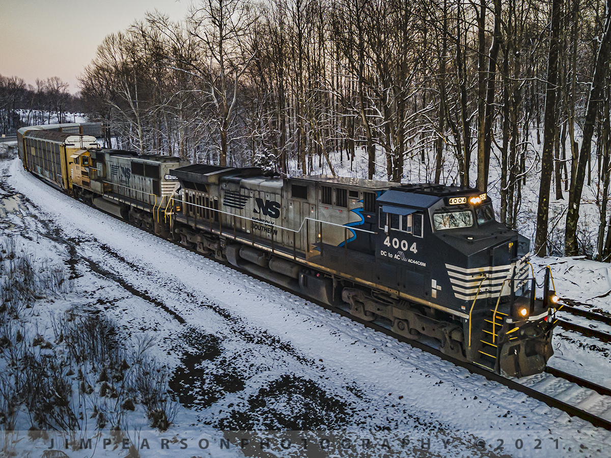 Norfolk Southern Sonic Bonnets at Taswell, Indiana

Norfolk Southern 4004 and 1800, the Black and Yellow "Sonic Bonnets" lead NS empty autorack train 124 west as they slowly pull through the siding at Taswell, Indiana to meet eastbound NS 168, on the NS Southern-East District on January 28th, 2021. 

Tech Info: DJI Mavic Air 2 Drone, RAW, 4.5mm (24mm equivalent lens) f/2.8, 1/160, ISO 200.