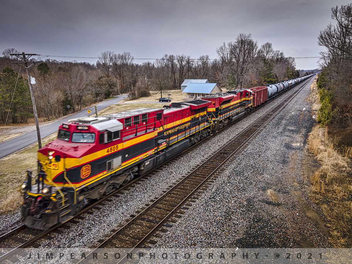 KCS leads a southbound ethanol train at Slaughters, Ky

It's not everyday we get Kansas City Southern leading any kind of train on the CSX Henderson Subdivision, so when I got reports from friends up the line to the north that CSX K443 was southbound with two coming I had to get trackside!

It was a gray, overcast, drizzling rain kind of day that keeps folks inside normally, but when word got out about it's move then there were railfans waiting its arrival between here where I caught it a the south end of Slaughters, Kentucky, all the way to Nashville, Tennessee and I'm sure points south on January 30th, 2021.

The hardest thing really about shooting pictures in bad weather is really just getting out the door!! I personally keep a couple large golf umbrellas just for this occasion!

However on this occasion I really wanted to put my Air 2 drone up for a shot that would show the tank train disappearing off into the distance and fortunately the rain slacked off enough where I could do so and this is the resulting photograph shot in the 48mp mode on the drone. The weather resulted in a slower shutterspeed that I wanted and I didn't want to boost the ISO so I settled for just a tad of blur on the locomotive, which gives the feeling of the speed of the train!

Tech Info: DJI Mavic Air 2 Drone, RAW, 4.5mm (24mm equivalent lens) f/2.8, 1/160, ISO 100.