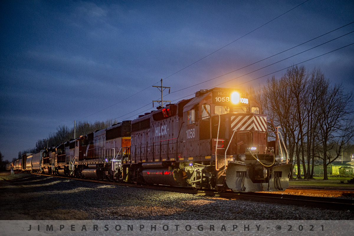 Night work at Metropolis, Illinois

HLCX lease unit 1058 heads up a BNSF local as it sits on the main in front of the Honeywell plant at Metropolis, Illinois waiting for a new crew to take over their train before continuing its night move north on the BNSF Beardstown Subdivision.

Tech Info: Nikon D800, RAW, Nikon 50mm f/1.4, 1/15, ISO 2000.