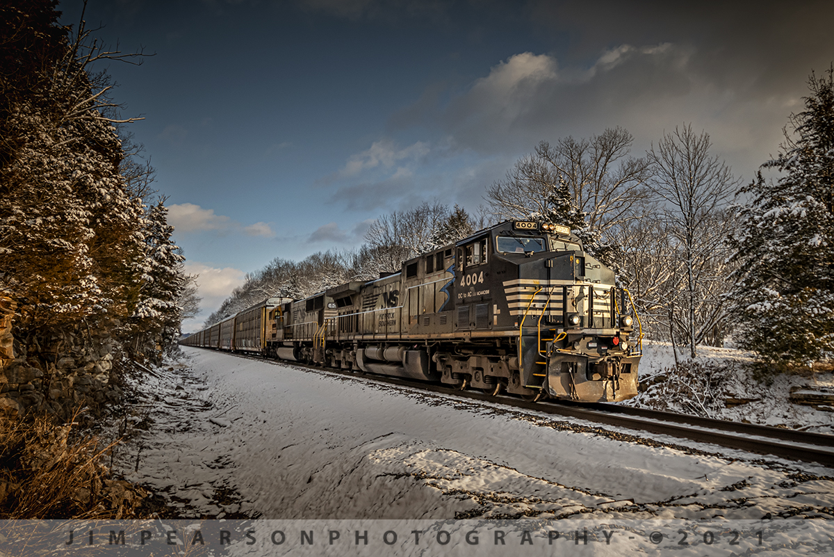 Norfolk Southern Sonic Bonnets at Ramsey, Indiana

With a winter wonderland scene and warm evening light we find Norfolk Southern 4004 and 1800, the Black and Yellow "Sonic Bonnets" leading empty autorack train 124 as they make their way west at Ramsey, Indiana on the NS Southern-East District on January 28th, 2021. 

I passed this spot when I was on my way to setup for this same train as it passed through the cut at Tunnel Hill Road, about 4 miles to the east of this crossing. I loved the look of the snow on the trees and was hoping I'd be able to make it the four miles back to this spot before the train got there, after catching it at the cut. 

Well, needless to say I made it, but probably not more than 10 seconds to spare. Enough time to grab the D800 with my 10-20mm lens, step into position and fire off a burst of about 5 shots before the lead unit was through the crossing. This is my favorite!

Tech Info: Nikon D800, RAW, Nikon 10-20mm DX lens @15mm f/4, 1/640, ISO 320.