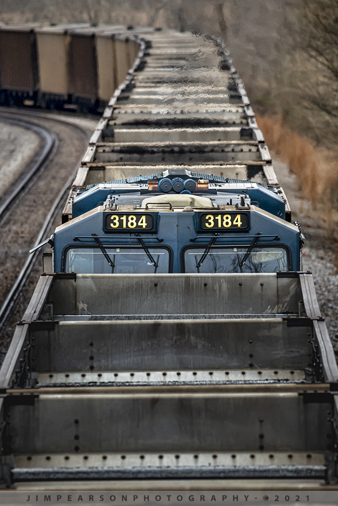 Northbound DPU at Nortonville, Ky

CSXT 3184 peeks over the top of empty coal hoppers as it sits on track 2 approaching the New Salem Church Loop overpass at Nortonville, Kentucky. We're on the Henderson Subdivision on January 30th, 2021, as the train waits for a couple south bounds to pass.

Shooting with long lenses at this focal length (600mm) can be a challenge most of the time, but not difficult! For me, I find that using the lens on a good sturdy monopod (I use a manfroto) and turning off the VR when doing so goes a long way in helping with sharpness. Also, keeping your shutterspeed to at least twice your focal length helps getting sharp images and also paying close attention to your focus. 

In my case, I normally pre-focus  where I want to shoot the picture and wait for the train to arrive there. This allows me to also make sure that my focus is good as at 600mm as sometimes the autofocus has to work hard to focus on the spot I want sharp. When this happens I get it close using the AF and then manually turn my focus ring to get it sharp and then wait for the subject arrives at that point. 

This all works best if you use your focus lock or back focus button. Otherwise if you have your focus set to your front shutter button, when you press the shutter button it'll try to refocus and you may miss the shot you want.

#trainphotography #railroadphotography #trains #railways #jimpearsonphotography 

Tech Info: Nikon D800, RAW, Sigma 150-600 @ 600mm, f/6.3, 1/1250, ISO 1250.