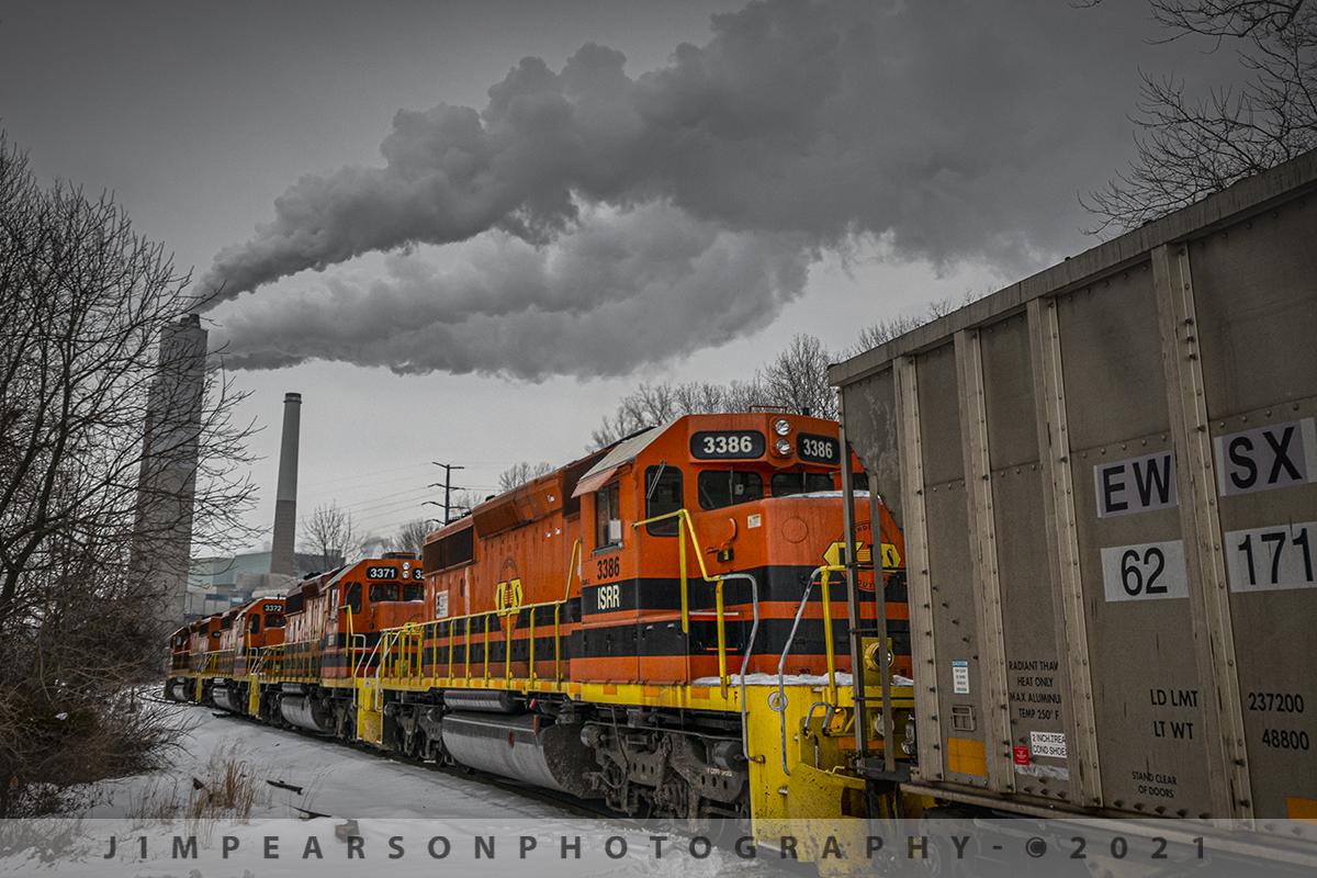 Indiana Southern IPL load arrives at Petersburg Generating Station

Indiana Southern Railroad (ISRR) 3383, 3372, 3371 and 3386 lead their train as they pull their loaded coal train into the Petersburg Generating Station on February 13th, 2021. The ISRR repeats this run 3-6 times a week from Peabody's Wildboar Mine in Lynnville, IN.

According to Wikipedia: The "Petersburg Generating Station is a major coal-fired power plant in Indiana, rated at 2.146-GW nameplate capacity. It is located on the White River near Petersburg in Pike County, Indiana, just 1 mile upstream from a much smaller coal-fired Frank E. Ratts Generating Station. Petersburg G.S. is owned and operated by Indianapolis Power & Light."

The Indiana Southern Railroad (reporting mark ISRR) is a short line or Class III railroad operating in the United States state of Indiana. It began operations in 1992 as a RailTex property, and was acquired by RailAmerica in 2000. RailAmerica was itself acquired by Genesee & Wyoming in December 2012.

Indiana Southern Railroad operates 186 miles of track from Indianapolis to Evansville. From Mars Hill (a neighborhood on the southwest side of Indianapolis) southwest through Martinsville and Spencer to Bee Hunter in Greene County, the ISRR runs on tracks that once made up the majority of the former Indianapolis & Vincennes Branch of the Pennsylvania Railroad. State Route 67 parallels the ISRR along much of this section.

From Bee Hunter to Elnora the ISRR has trackage rights over the Indiana Rail Road. ISRR tracks resume from Elnora through Washington in Daviess County, Petersburg in Pike County, Oakland City in Gibson County, Elberfeld in Warrick County and Daylight in Vanderburgh County before terminating in Evansville along the former New York Central's Evansville & Indianapolis Branch.

Tech Info: Nikon D800, RAW, Nikon DX 10-20mm lens @20mm f/4.5, 1/1600, ISO 250.