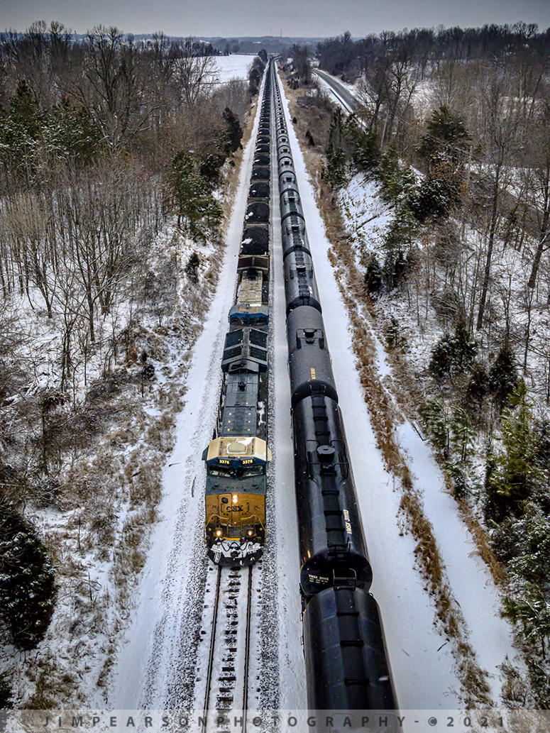 A snowy meet at Slaughters, Kentucky

Another biting cold snow shot from February 17th, 2021 as loaded CSX coal train N302 heads south as empty ethanol train K442 waits in the siding for him to pass at Slaughters, ky on the Henderson Subdivision.

Tech Info: DJI Mavic Air 2 Drone, RAW, 4.5mm (24mm equivalent lens) f/2.8, 1/400, ISO 400.