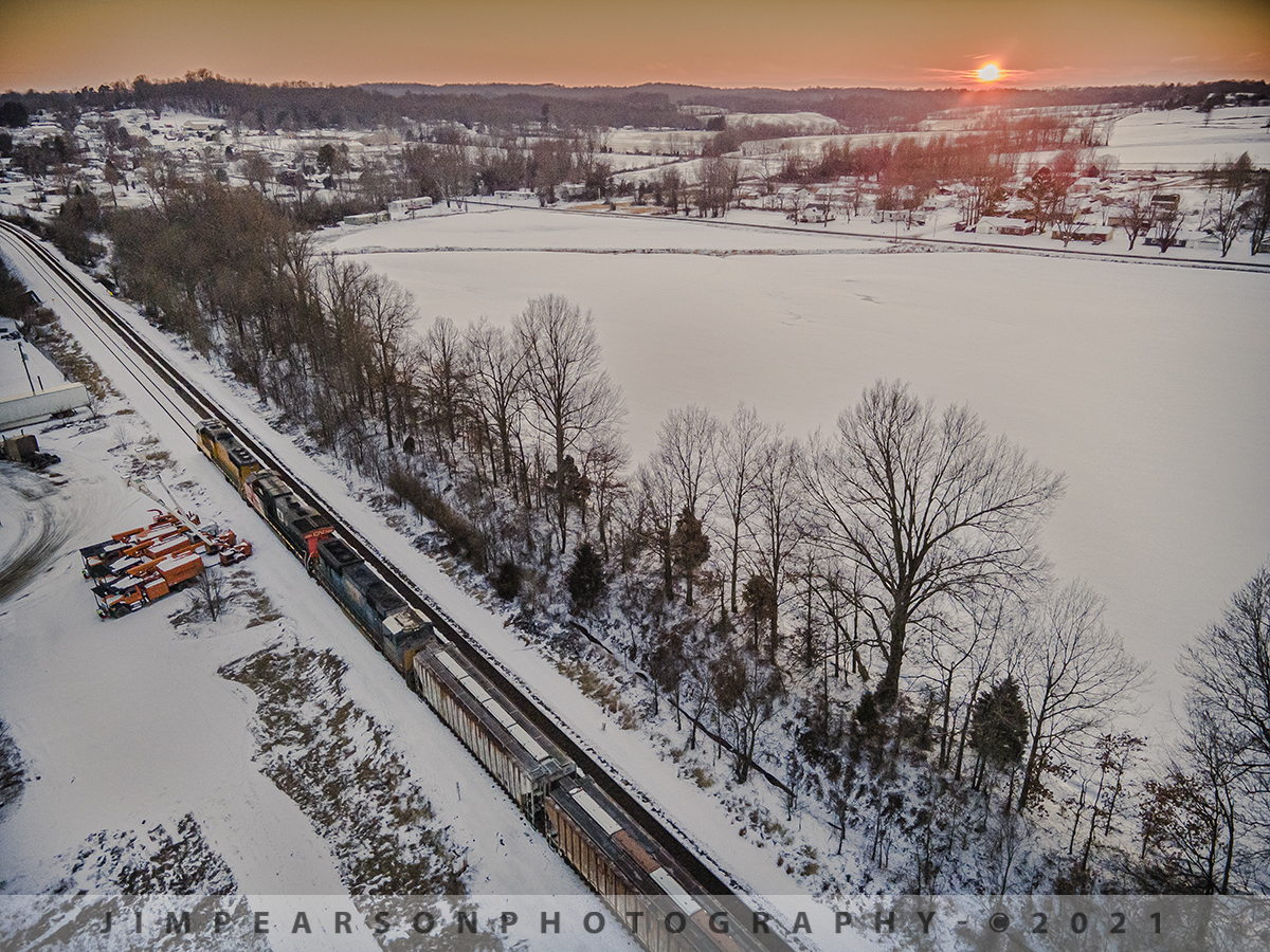 A surprise southbound move

Fellow railfan Cooper Smith and I spent the day on Saturday, February 19th, 2021 chasing trains on the Henderson Subdivision (HD) through the new additional 3-5" of snowfall. 

We had made our way all around the HD and ended up at Henderson, Ky where we first caught this surprise lash-up on CSX 403 of UP 4601, CN 2268 and a flared radiator CSX unit, #4792.

This shot is of the train as it pulls on south at Sebree, Kentucky after meeting a northbound empty coal train at sunset.

Tech Info: DJI Mavic Air 2 Drone, RAW, 4.5mm (24mm equivalent lens) f/2.8, 1/320, ISO 100.