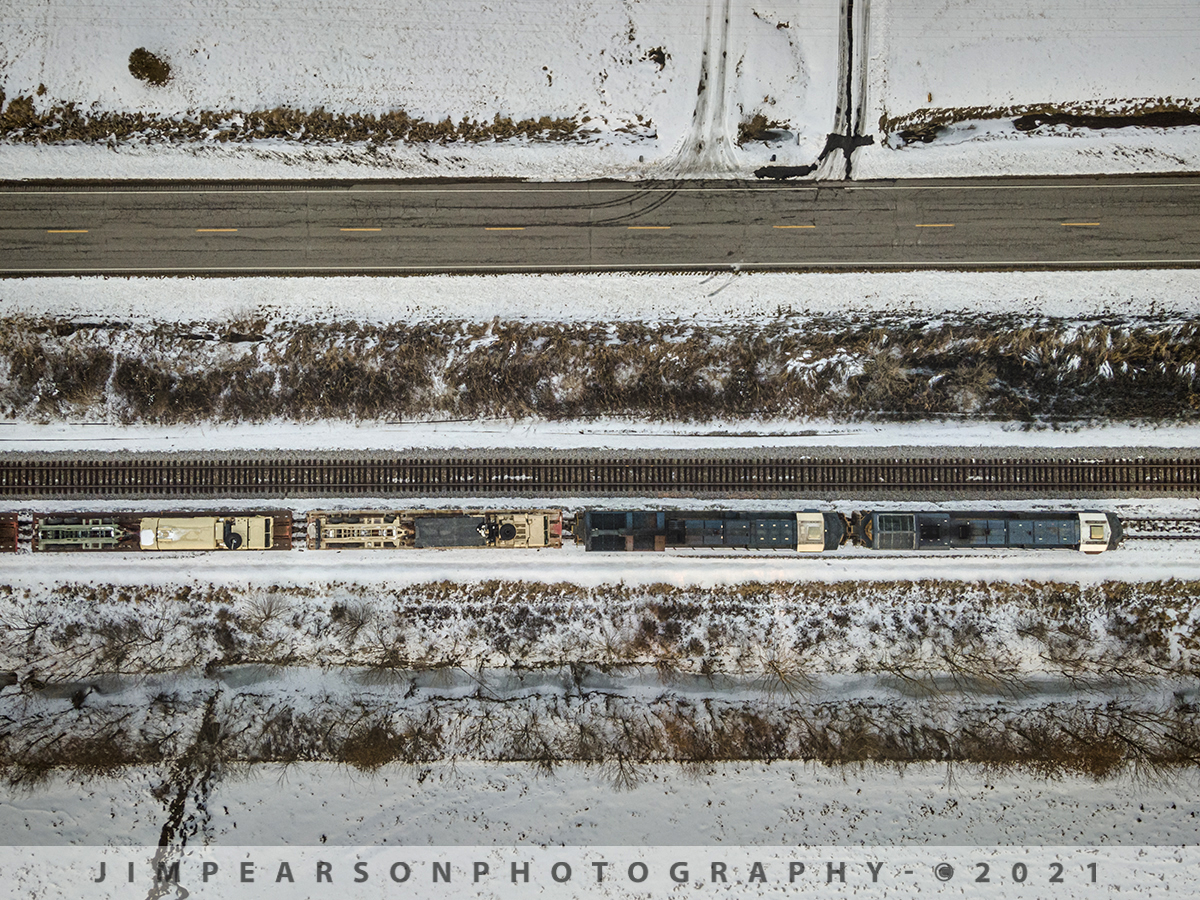 A military train and a study in lines in the snow

I love how the lines flow in this shot of CSX W809 that was waiting to head south February 20th, 2021 on the Henderson Subdivision with a load of military vehicles on track two at Nortonville, Ky. 

Here we find the train where it finally crawled to a stop just south of Nortonville with CSXT 5473 and 3348 leading the 5,000+ load of military vehicles elephant style, to wait for another northbound Q648. Him stopping for this meet worked really well for my shot since the train came to a full stop and I was able to shoot with a slow shutterspeed to keep my ISO and noise down from the low light scene as the last rays of light swept across the valley!

I did crop this image some from the full frame 48mp file in order to keep the drone from hovering directly over the train, via FAA rules.

Tech Info: DJI Mavic Air 2 Drone, RAW, 4.5mm (24mm equivalent lens) f/2.8, 1/80, ISO 100.