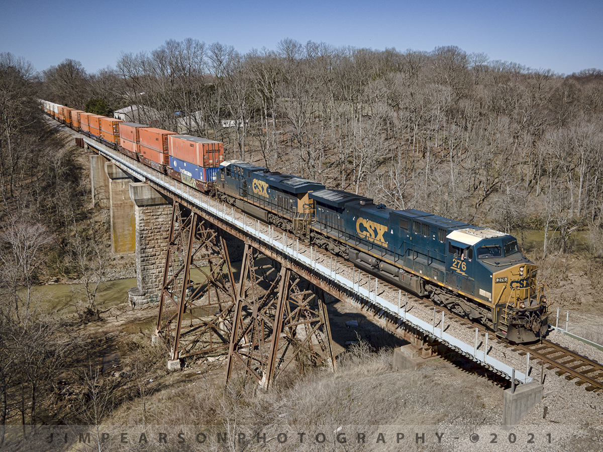 Southbound hot intermodal at Sulfur Creek, Springfield, TN

Just a week before the ground here was covered with snow and the temperature was in the teens, a huge difference on March 3rd, 2021 here at the Sulfur Fork bridge just north of Springfield, Tennessee where the day was beautiful and the temperature hovering around 70 degrees!

Here we find CSXT 276 and 904 leading hot intermodal Q029-02 as they head south over the Sulfur Creek bridge on the CSX Henderson Subdivision as they make their way to their final destination of Jacksonville, FL from Chicago, IL.

Tech Info: DJI Mavic Air 2 Drone, RAW, 4.5mm (24mm equivalent lens) f/2.8, 1/1000, ISO 100.