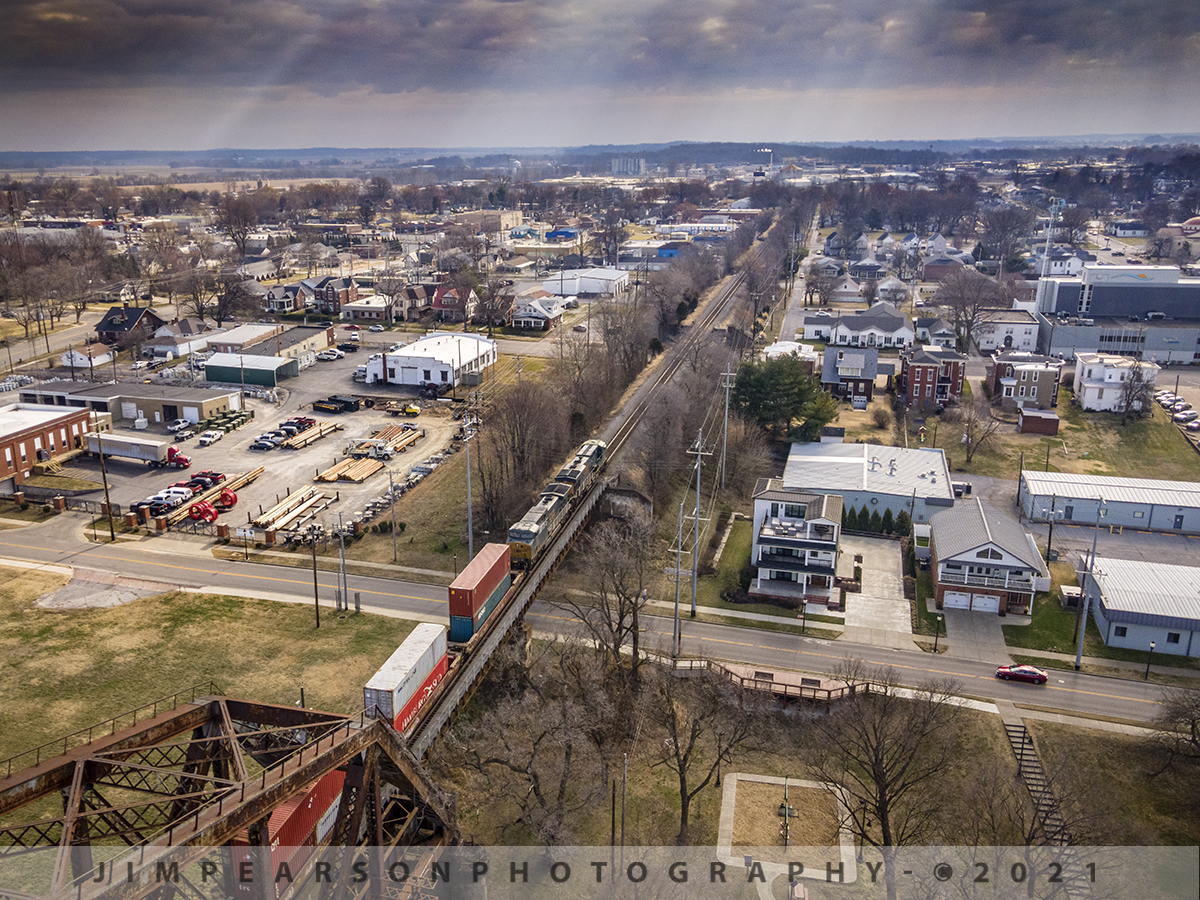 CSX Heading southbound into the light!

CSX Q025 heads southbound (railroad south, but more southeast) towards the rays of early morning light, at Henderson, Kentucky, after crossing the Ohio River bridge on the CSX Henderson Subdivision with CSXT 3184 leading the way.

Tech Info: DJI Mavic Air 2 Drone, RAW, 4.5mm (24mm equivalent lens) f/2.8, 1/640, ISO 100.