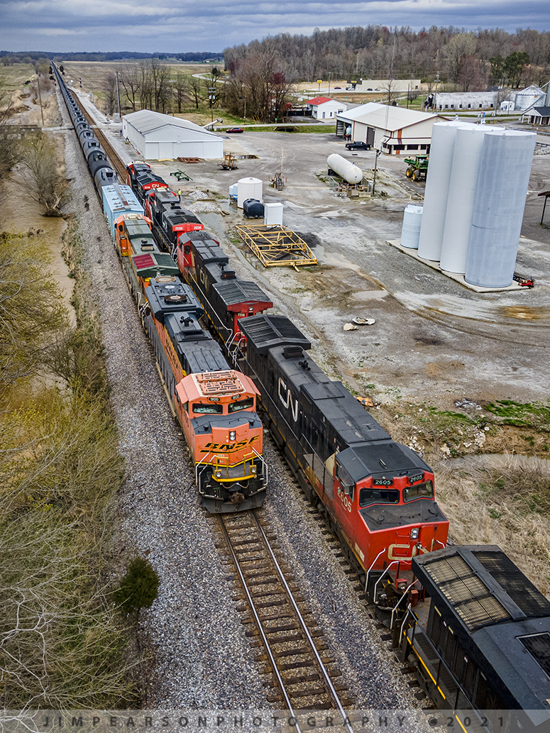 Canadian National and BNSF on the CSX Henderson Subdivision

The CSX Henderson Subdivision usually sees foreign power on a regular basis these days and March 25th, 2021 was defiantly a busy one, with a lot of interesting moves for me to chase and photograph!

Here we have loaded southbound ethanol train K423 (Bensenville, IL to Tampa, FL), with BNSF 9100 and 4418 leading, on its way south as it meets an empty ethanol train K644 (Chicago, IL  Jacksonville, FL) with Canadian National 3246, 2235, 2518, 2605 and 2293 at Slaughters, Kentucky, as it waits in the siding to continue its move on north on the Henderson subdivision.

Unit trains of one type or another are some of my favorite trains to photograph and video and when you throw into the mix foreign power on top of that and it makes me want to chase all day long!! I just love the uniformity of the cars, like snakes winding their way along the landscape.

Tech Info: DJI Mavic Air 2 Drone, RAW, 4.5mm (24mm equivalent lens) f/2.8, 1/320, ISO 100.