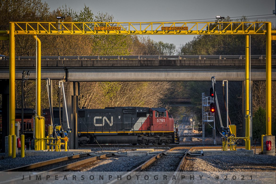 CN 5761 headed south at Fulton, Kentucky

On April 3rd, 2021 Canadian National 5761 pulls away from the fuel racks on the CN Bluford Subdivision, as it passes the fuel racks on the CN Cairo Subdivision, on its way south with a manifest at Fulton, Kentucky as the last bit of sunlight rakes across the scene. The tracks on the other side of the engine are the West Tennessee Railroad, which interchanges with the CN here at Fulton.

Fulton is also an Amtrak intercity train stop where the station is a flag stop on the City of New Orleans route, served only when passengers have tickets to and from the station. This is an unstaffed station; there is no agent and no assistance, and it normally passes through here in the dark.

Tech Info: Nikon D800, RAW, Sigma 150-600mm @ 550mm, f/8.5, 1/400, ISO 500.