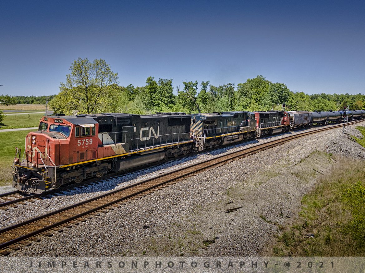 CSX southbound K650 with CN and BCRAIL power at Kelly, Ky

CSX K650 makes its way past the north end of the siding at Kelly, Kentucky as CN 5759, BCRAIL 4646 and CN 5618 lead the way on May 12th, 2021 on the Henderson Subdivision with a load of ethanol. 

Tech Info: DJI Mavic Air 2 Drone, RAW, 4.5mm (24mm equivalent lens) f/2.8, 1/800, ISO 100.