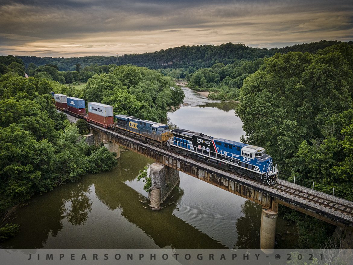 CSXT 3194 Spirit of our Law Enforcement unit at Harpeth River, Pegram, Tennessee

I've been wanting to catch this unit out in the wild since it was unveiled back in 2019 and it finally got into my shooting area yesterday, June 5th, 2021. Here I caught CSXT 3194 (Spirit of our Law Enforcement) as it crossed over the Harpeth River through the hills of Tennessee, just west of Pegram, as it led Q125-05 (Memphis, TN - East Savannah, GA). 

This was during the Memphis to Nashville, TN leg of its journey and this is my favorite spot from where I chased it between New Johnsonville and Nashville on the CSX Bruceton Subdivision along with a bunch of fellow railfans. A big shoutout goes to all the folks that gave heads up and sent messages about this move for all of us who were out trackside!

From CSX Press Releases - CSX Transportation's "Spirit of our Law Enforcement" commemorative locomotive CSXT 3194 is being renamed to honor our nation's police officers who dedicate their lives to serve and protect communities across our network.

CSXT 3194 is painted primarily in black, blue and white, with the slogans "To Protect and Serve" and "Honoring Our Law Enforcement." It also prominently features the CSX Transportation Railroad Police logo, as well as police, fire and emergency responder logos.

Tech Info: DJI Mavic Air 2 Drone, RAW, 4.5mm (24mm equivalent lens) f/2.8, 1/640, ISO 100.