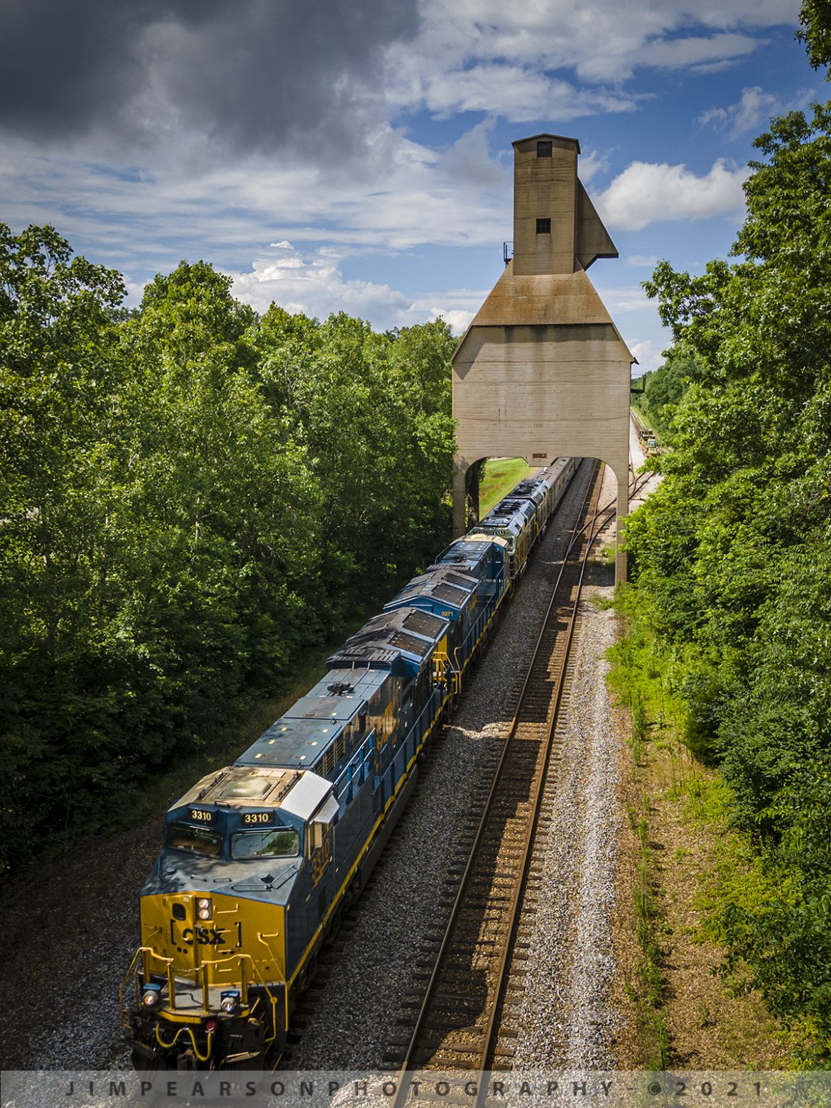 CSX President's Special P001 southbound at Sullivan, IN

CSX President's Passenger train P001 heads south as it passes under the old Louisville and Nashville Railroad coaling towers at Sullivan, IN, on the CE&D Subdivision, with CSX GEVO units 3310, 3271 leading and CSXT 1 & 2 trailing as they pull 11 cars at a little over 1,000ft long southbound on June 10th, 2021. They were leading due to issues with the DPU on the F units, which have since been fixed.

CSX repainted two of its F40PH locomotives, to be used on its business train, into predecessor Baltimore & Ohio's blue, gray, and black paint scheme. CSX1 is former 9998 (former Amtrak 288) and from what I can find out CSXT 2 is the former F40PH 9993 (former Amtrak 395. The other F40s are expected to be painted in the same scheme in the coming months as they are cycled through the shops.

Tech Info: DJI Mavic Air 2 Drone, RAW, 4.5mm (24mm equivalent lens) f/2.8, 1/500, ISO 100.