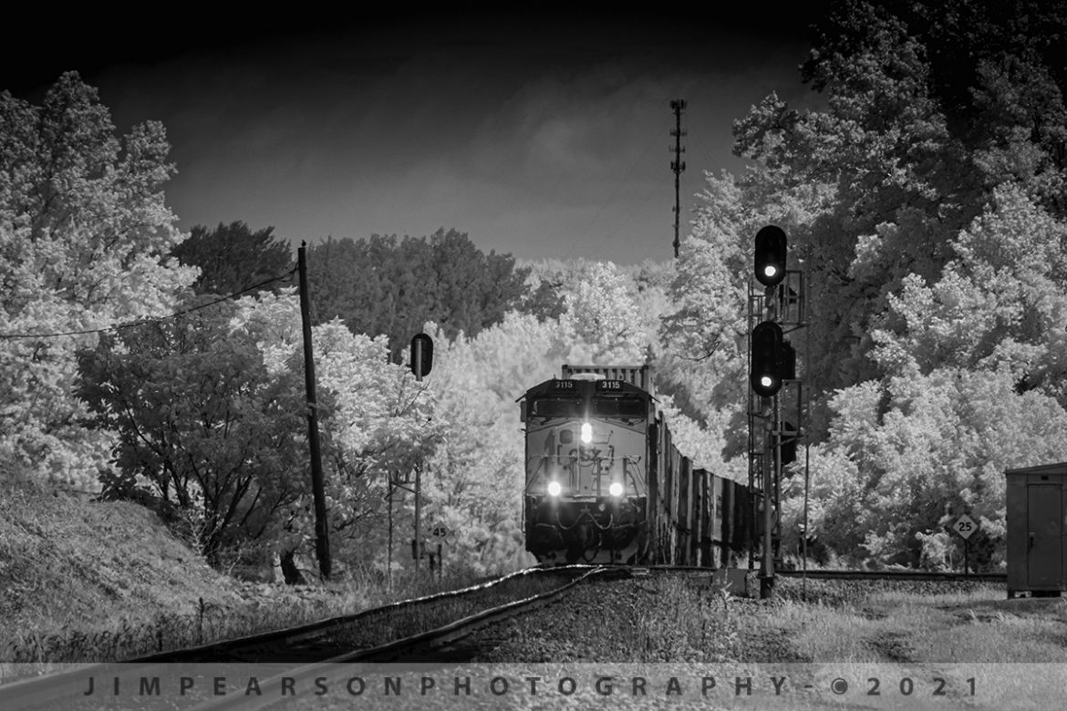 CSXT 3115 pulls upgrade leading Q025 at Mortons Gap, KY

CSX Q025 pulls up grade out of the valley with CSXT 3115 leading the way at Mortons Junction on the Henderson Subdivision as it heads south at Mortons Gap, KY in this infrared shot on July 16th, 2021.

Tech Info: Fuji XT-1, RAW, Converted to 720nm B&W IR, Sigma 150-600 @ 300mm, f/8, 1/500, ISO 400.