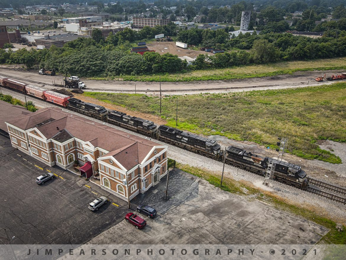 NS 148 arrives at Decatur, Illinois as it passes the old Wabash Station

Running elephant style, NS 9524, 3630, 1078 and 9598 lead train 148 (Avondale Yard - Kansas City, MO to East Yard - Decatur IL) as it passes the old Wabash Station on July 21st, 2021 on the NS Brooklyn District, as it arrives at Decatur, Illinois and approaches the Wabash/IC Crossover, before entering the yard, finishing its daily run.

According to Wikipedia: The Decatur station, also known as the Wabash Railroad Station and Railway Express Agency, is a historic railway station located at 780 East Cerro Gordo Street in Decatur, Illinois. Built in 1901, the station served trains on the Wabash Railroad, the most economically significant railroad through Decatur. Architect Theodore Link designed the Classical Revival building. Amtrak discontinued service to the station in the 1983, and it has since been listed on the National Register of Historic Places.

Restored in 2002, it is now houses the Wabash Depot Antique Mall and sits close to the WABIC (Wabash - Illinois Central) railroad crossover. During its peak in 1907 there were 72 daily passenger trains, today, there are none that stop here.

Tech Info: DJI Mavic Air 2 Drone, RAW, 4.5mm (24mm equivalent lens) f/2.8, 1/400, ISO 100.