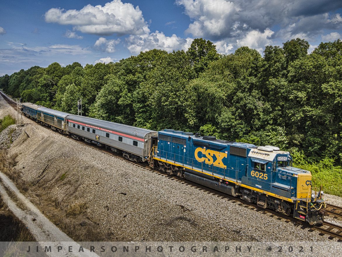 CSX Track Inspection trainset W001 southbound at Kelly, KY

CSXT 6025 leads CSX W001 inspection train as it splits the signals on the north end of the siding at Kelly, Kentucky with Southern Pacific Birch Grove, CSX Florence and TGC2 Geometry Car trailing, as they make their way south on the Henderson Subdivision on July 13, 2021.

Research from a friend reveals: Built by The Budd Company in 1950 as 6 double bedroom, 10 roomette sleeping car 9020 for service on the Southern Pacific's Los Angeles-New Orleans "Sunset Limited." The car was acquired by Amtrak in 1971 and renumbered 2696. Converted to Heritage 10-6 sleeper with handicapped roomette in 1980 and renumbered to 2451 and named Birch Grove. 

The Car was retired in 1995 and sold to Cincinnati Railway Company. It was upgraded 2002-03 and had a complete interior upgrade in 2005. As of 2014 it was owned by the Cincinnati Railway Company.

CSX purchased the Birch Grove car from the Cincinnati Railway in September of 2020 and from what I find online they plan to use it as part of its executive fleet. They also bought the dome car Moonlight Dome from them for the same reason.

According to Wikipedia: A track geometry car (also known as a track recording car) is an automated track inspection vehicle on a rail transport system used to test several parameters of the track geometry without obstructing normal railroad operations. Some of the parameters generally measured include position, curvature, alignment of the track, smoothness, and the cross level of the two rails. The cars use a variety of sensors, measuring systems, and data management systems to create a profile of the track being inspected.

One of the earliest track geometry cars was Car T2 used by the U.S. Department of Transportation's Project HISTEP (High-Speed Train Evaluation Program). It was built by the Budd Company for Project HISTEP to evaluate track conditions between Trenton and New Brunswick, NJ, where the DOT had established a section of track for testing high-speed trains, and accordingly, the T2 ran at 150 miles per hour or faster.

Tech Info: DJI Mavic Air 2 Drone, RAW, 4.5mm (24mm equivalent lens) f/2.8, 1/800, ISO 100.