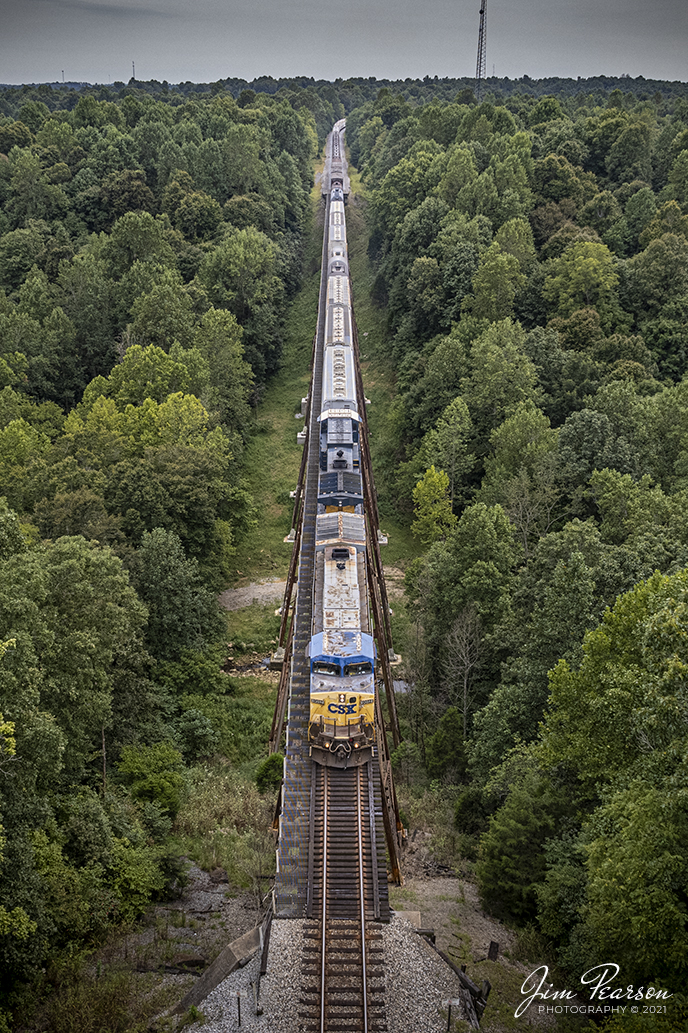 CSX X605-04 heads north across the Gum Lick Trestle, just south of Crofton, Kentucky with 9012 leading the way. It is a Waycross, GA - Rose Lake, IL train that has been rerouted via the Henderson Subdivision due to flooding from the recent hurricanes. The lead engine is a Dash 9 in YN2 paint, led by CSXT 9012 which is a reactivated unit that has been in storage.

Tech Info: DJI Mavic Air 2S Drone, RAW, 22mm, f/2.8, 1/640, ISO 100, September 4, 2021.

#trainphotography #railroadphotography #trains #railways #dronephotography #jimpearsonphotography