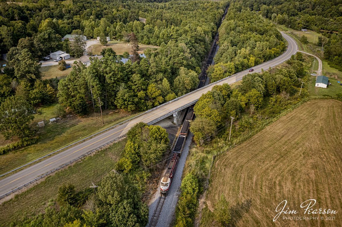 Hot off the drone we find Paducah and Louisville Railway 2013, in its University of Louisville paint, passing under the highway 70 west overpass as it leads PRX1, a loaded coal train, south through Richland, Kentucky, less than 30 minutes ago on September 11th, 2021.

Tech Info: DJI Mavic Air 2S Drone, RAW, 22mm, f/2.8, 1/1250, ISO 140, September 11, 2021.

#trainphotography #railroadphotography #trains #railways #dronephotography #jimpearsonphotography